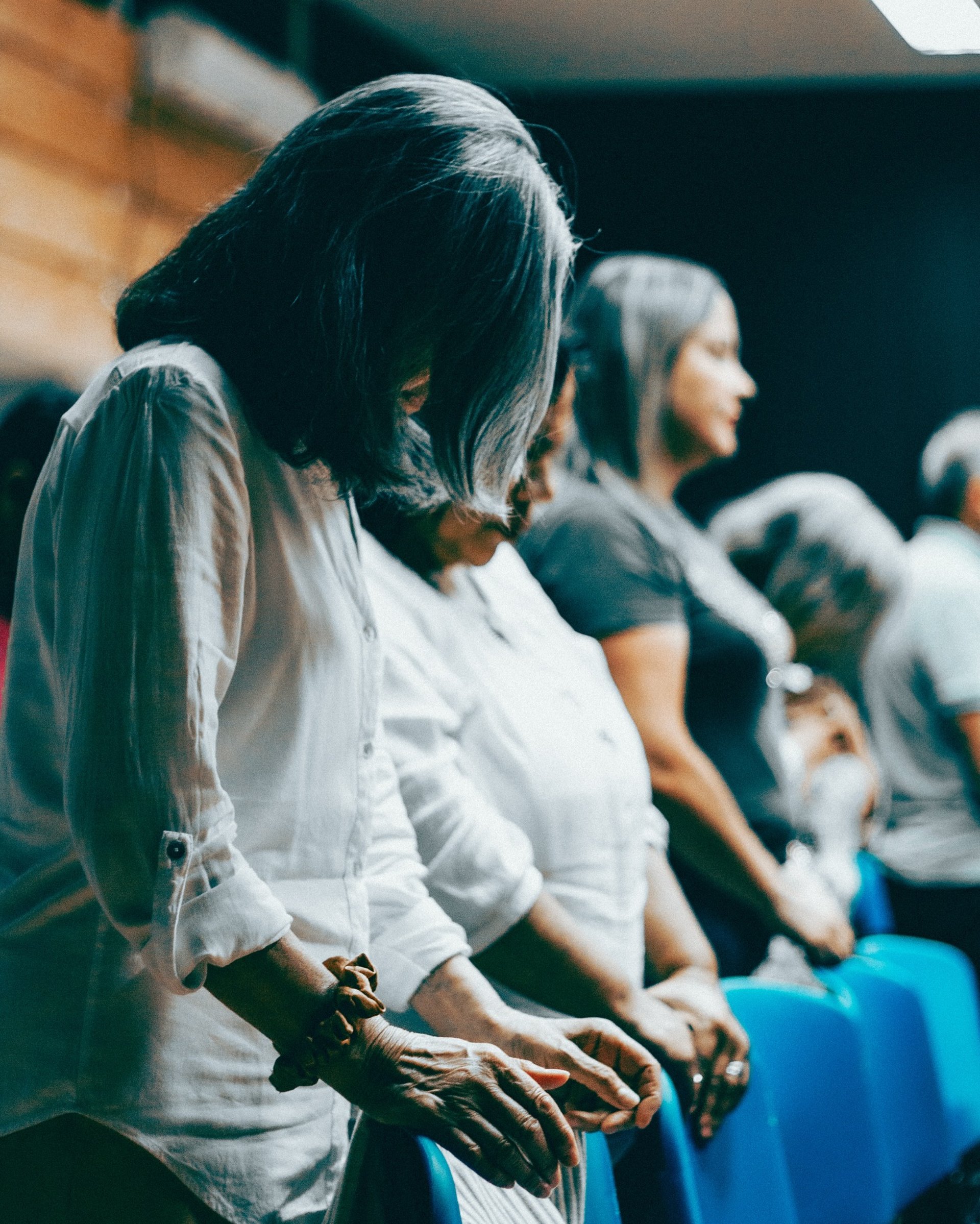 an abstract photo of a curved building with a blue sky in the background