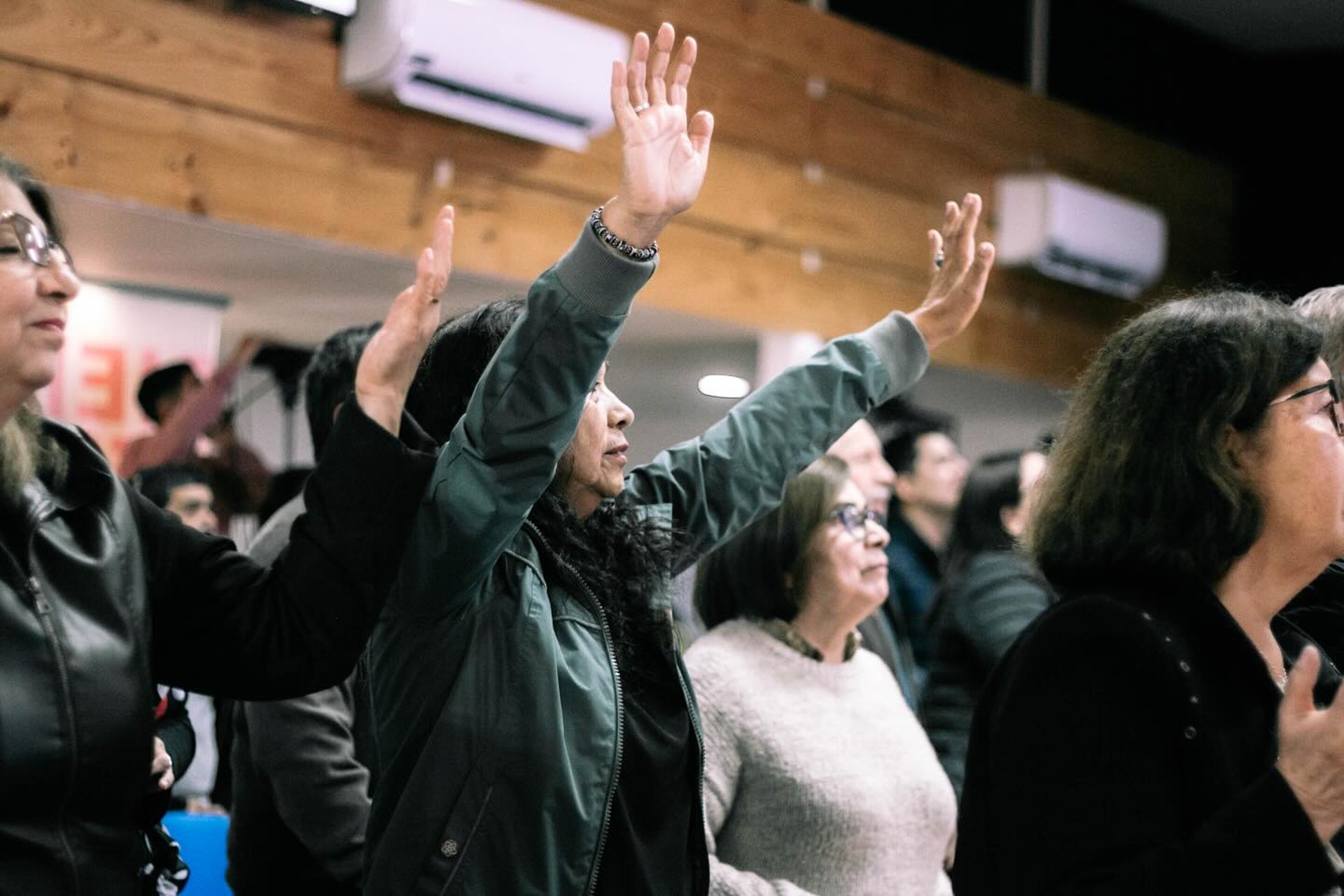 an abstract photo of a curved building with a blue sky in the background