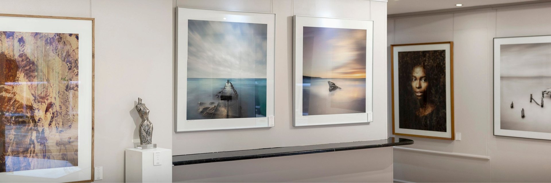 Interior of Osner Gallery in Hout Bay, featuring fine art photography, original artworks, by Martin and Samantha Osner