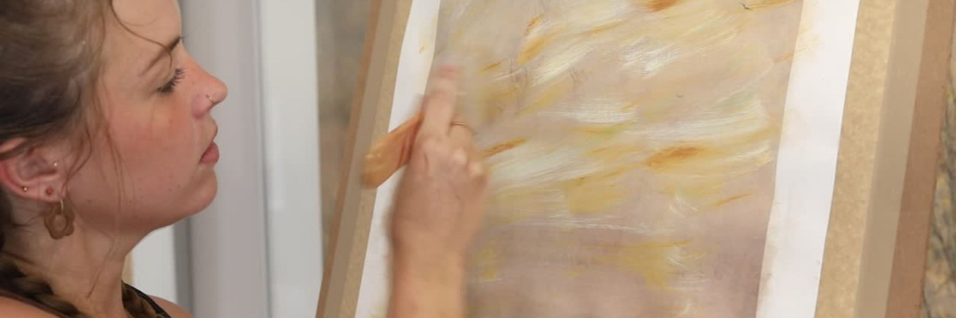 Samantha Lee Osner creating a layered abstract mixed media painting in her Cape Town studio