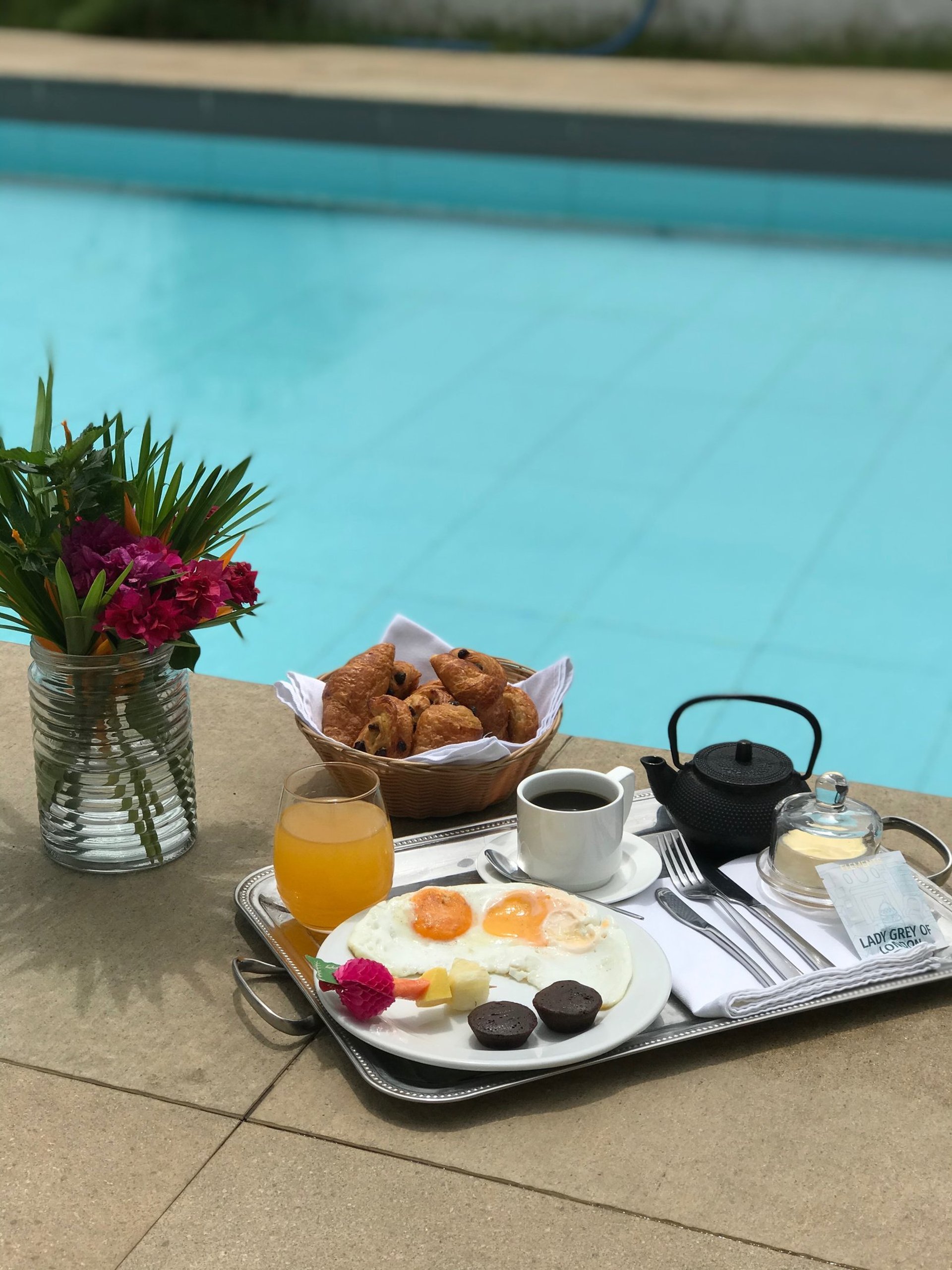 woman wearing yellow long-sleeved dress under white clouds and blue sky during daytime
