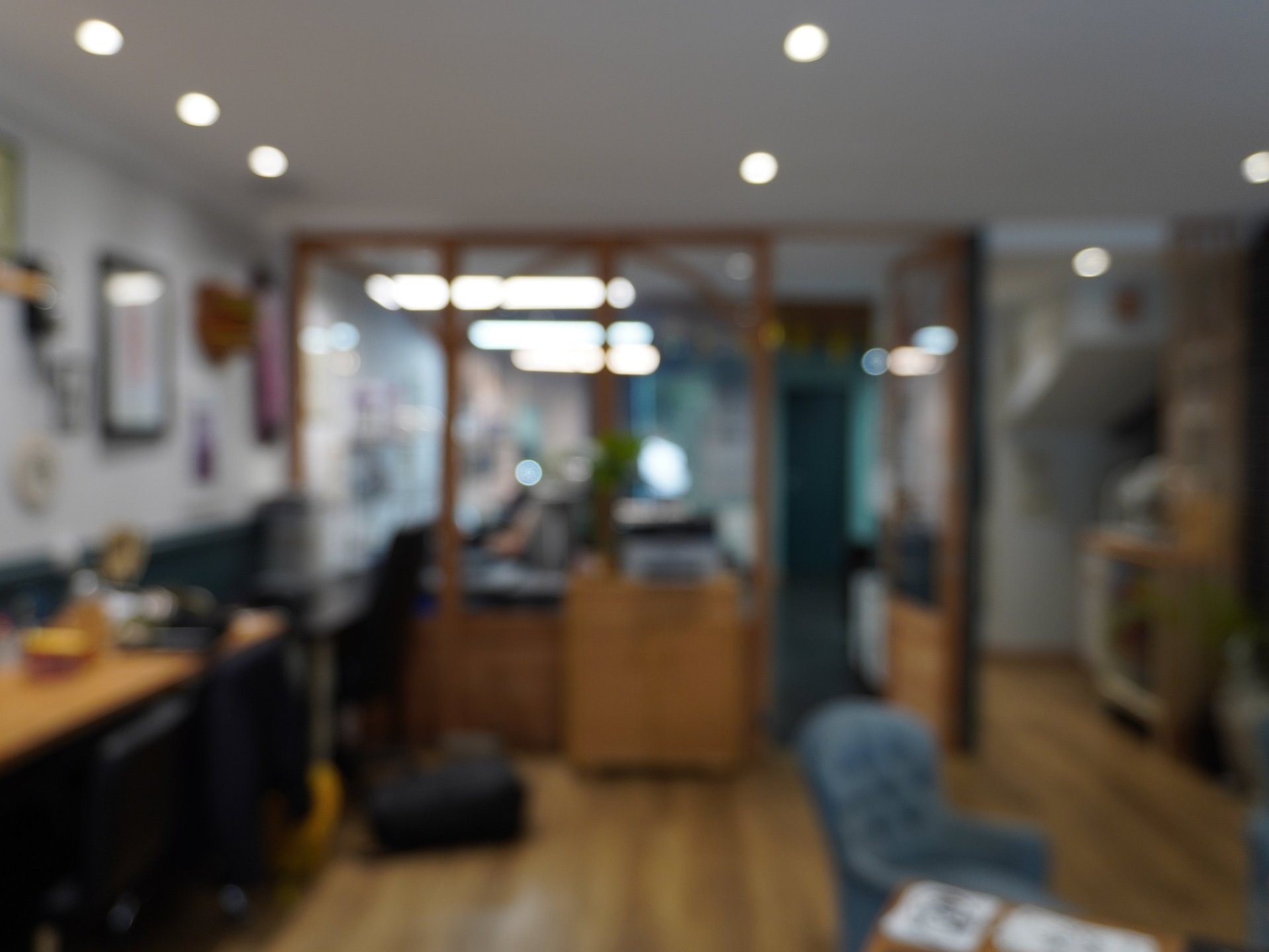 black kitchen appliance on kitchen island with pendant lights