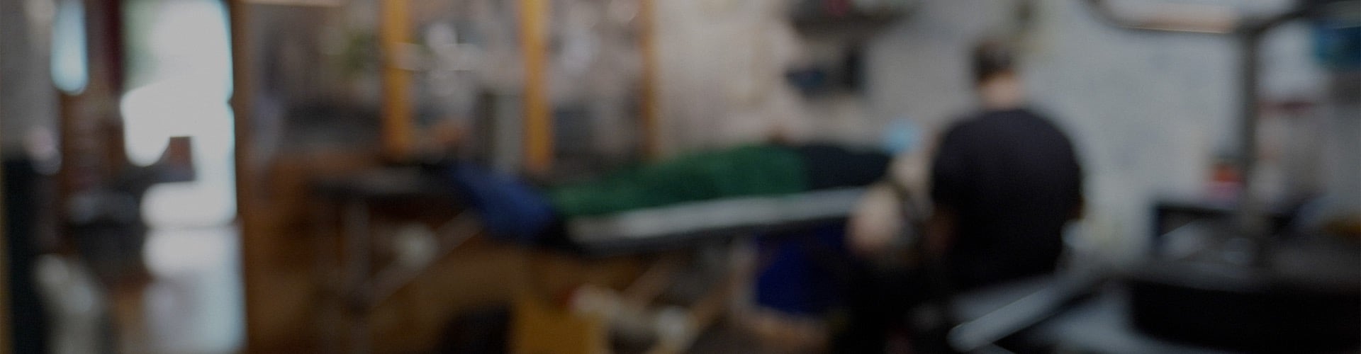 black kitchen appliance on kitchen island with pendant lights