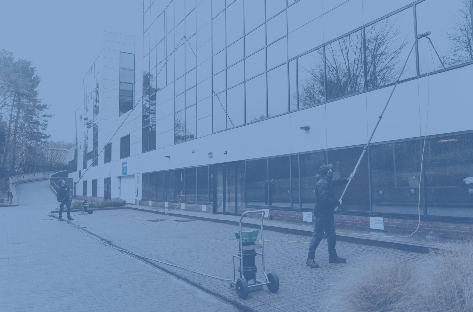 an abstract photo of a curved building with a blue sky in the background