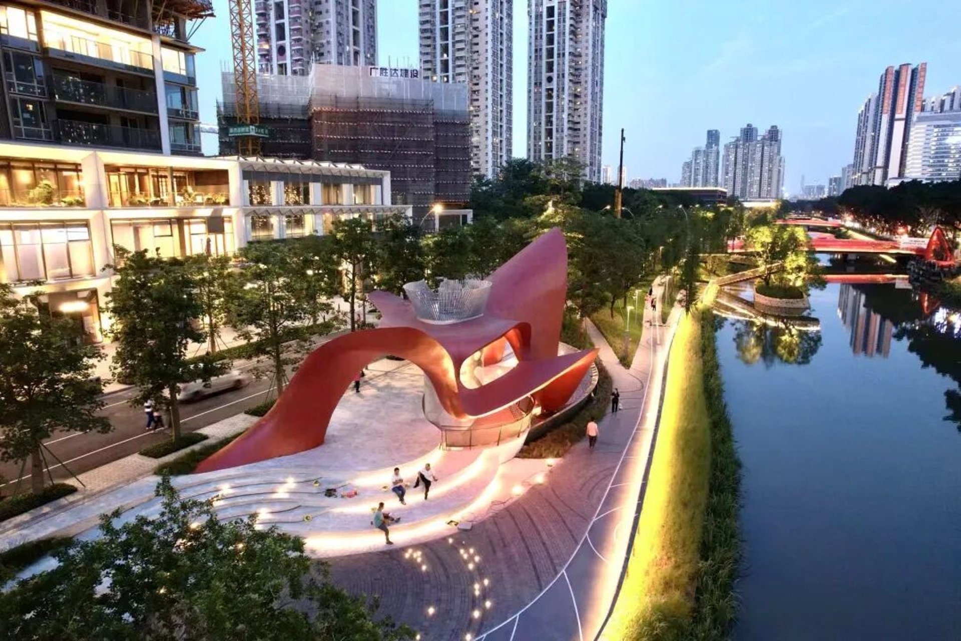 an abstract photo of a curved building with a blue sky in the background