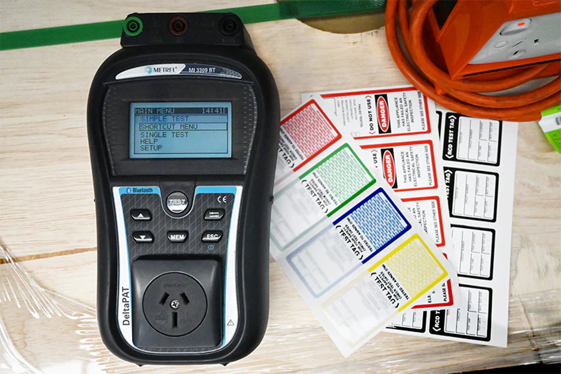 a test and tag machine on a table with tags