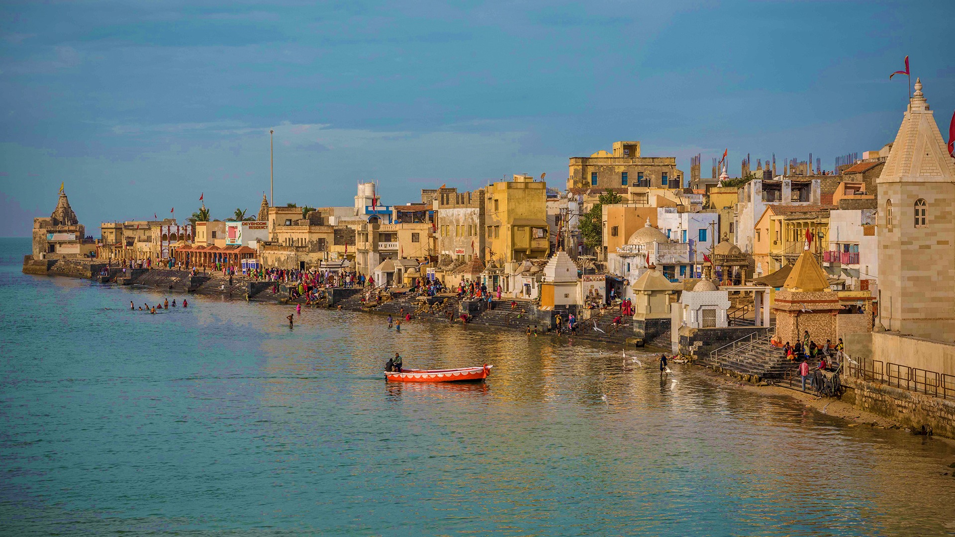 an abstract photo of a curved building with a blue sky in the background