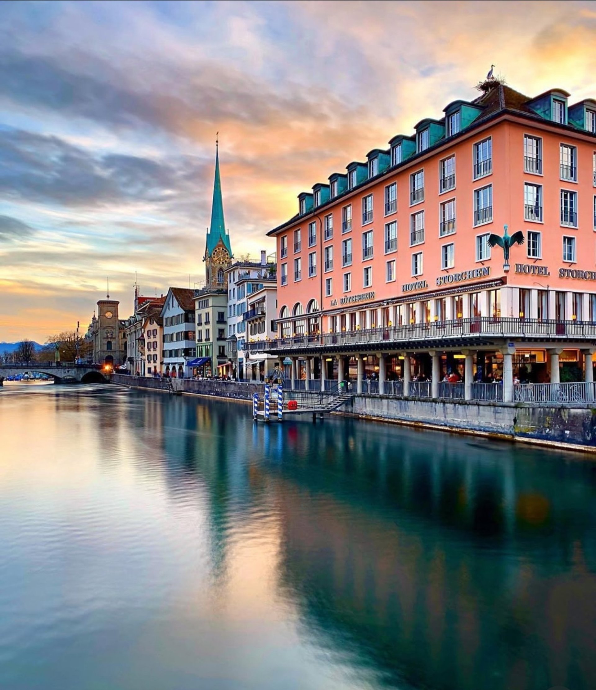 an abstract photo of a curved building with a blue sky in the background