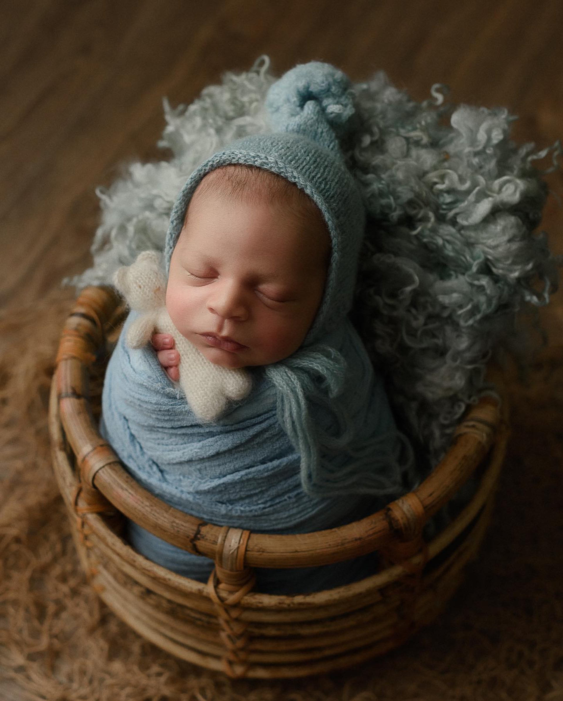 sleeping baby on white textile