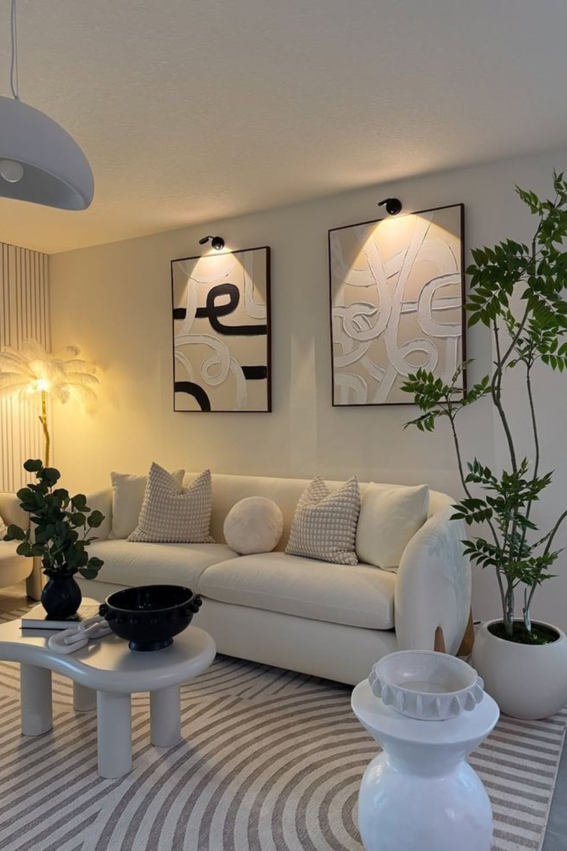 a living room filled with furniture and a large window