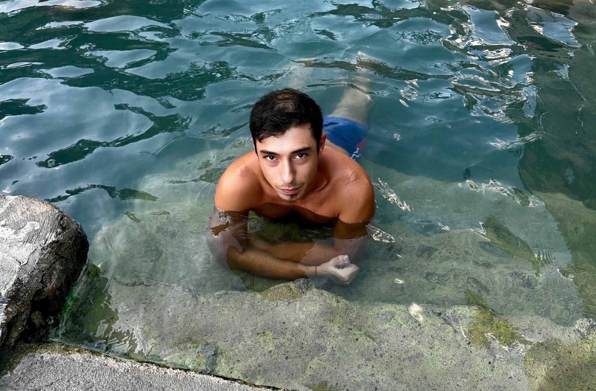 an abstract photo of a curved building with a blue sky in the background