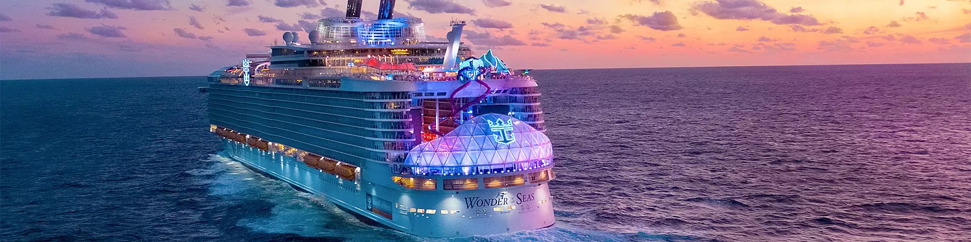 white ship on sea during sunset