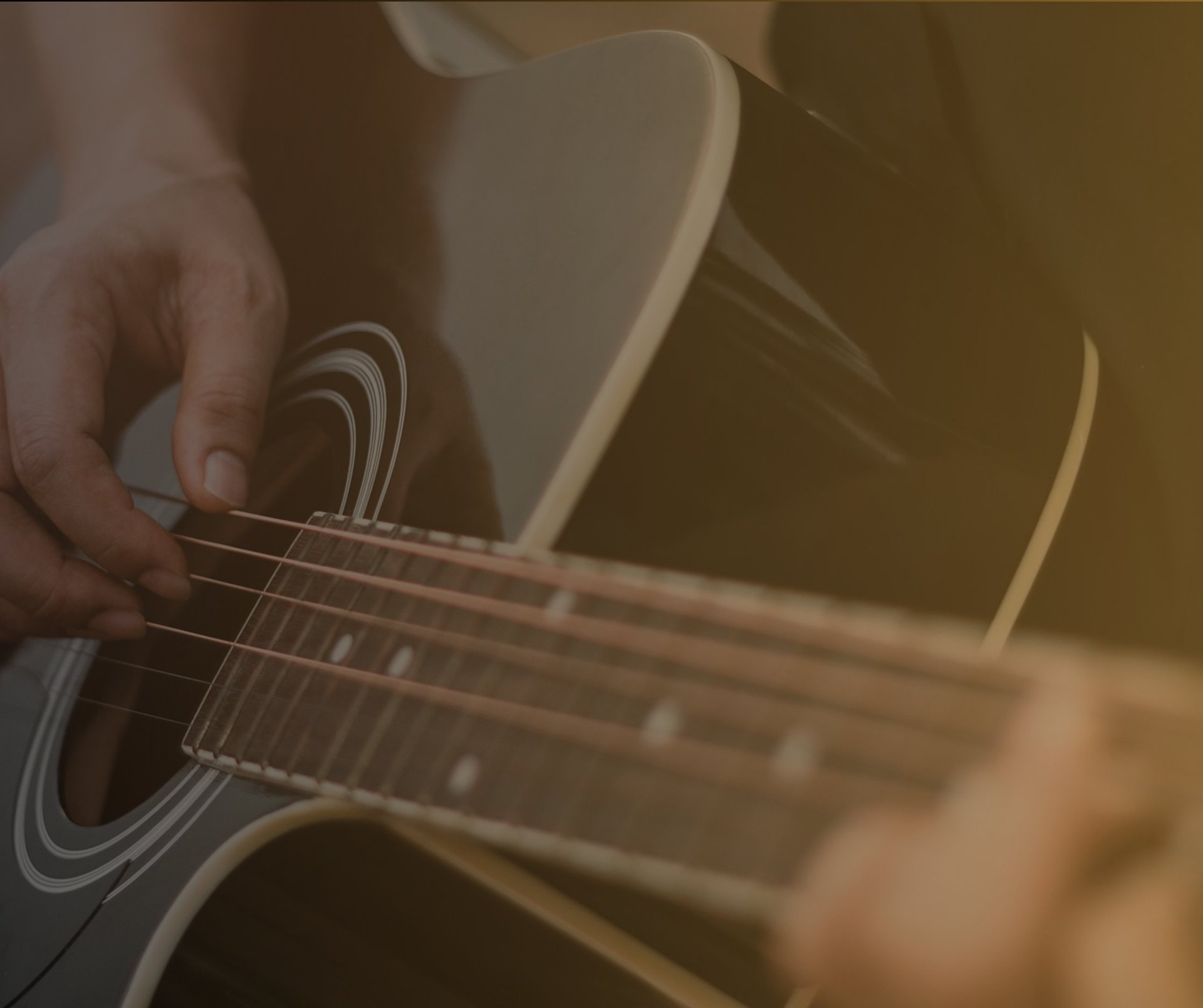 grayscale photo of person holding guitar neck and strings