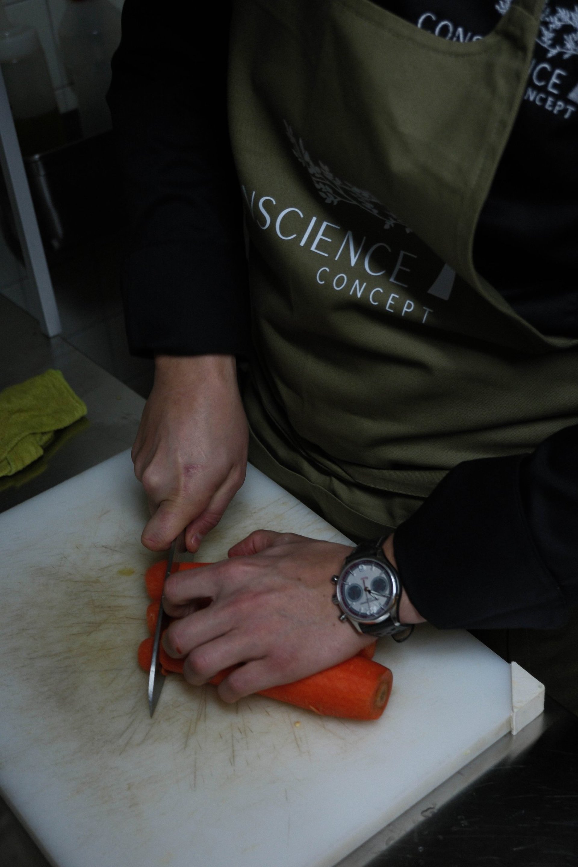 person slicing vegetable