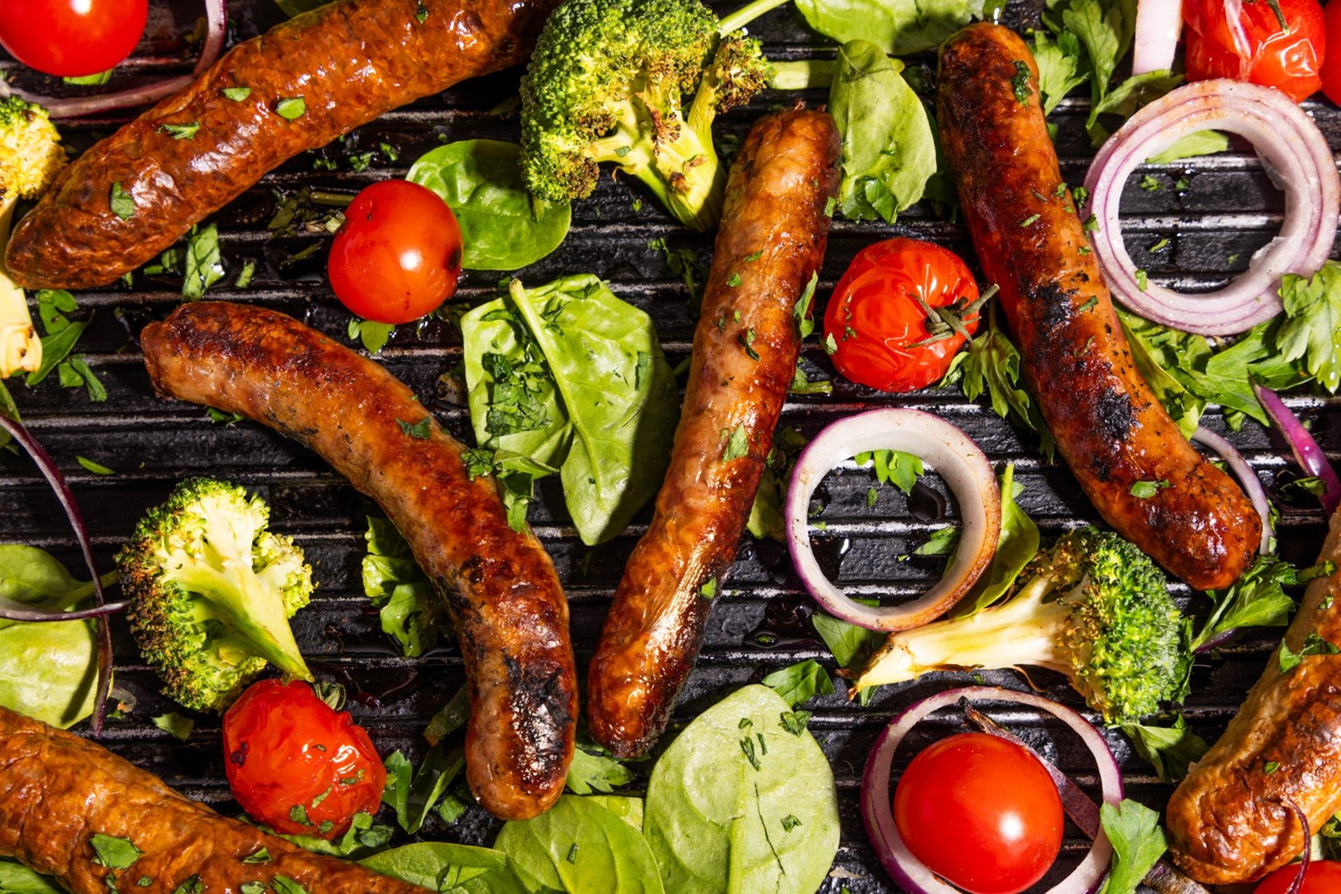 Sustainable plant-based, nutritionally-dense, hypoallergenic protein and fibre sausages with vegetables surrounding