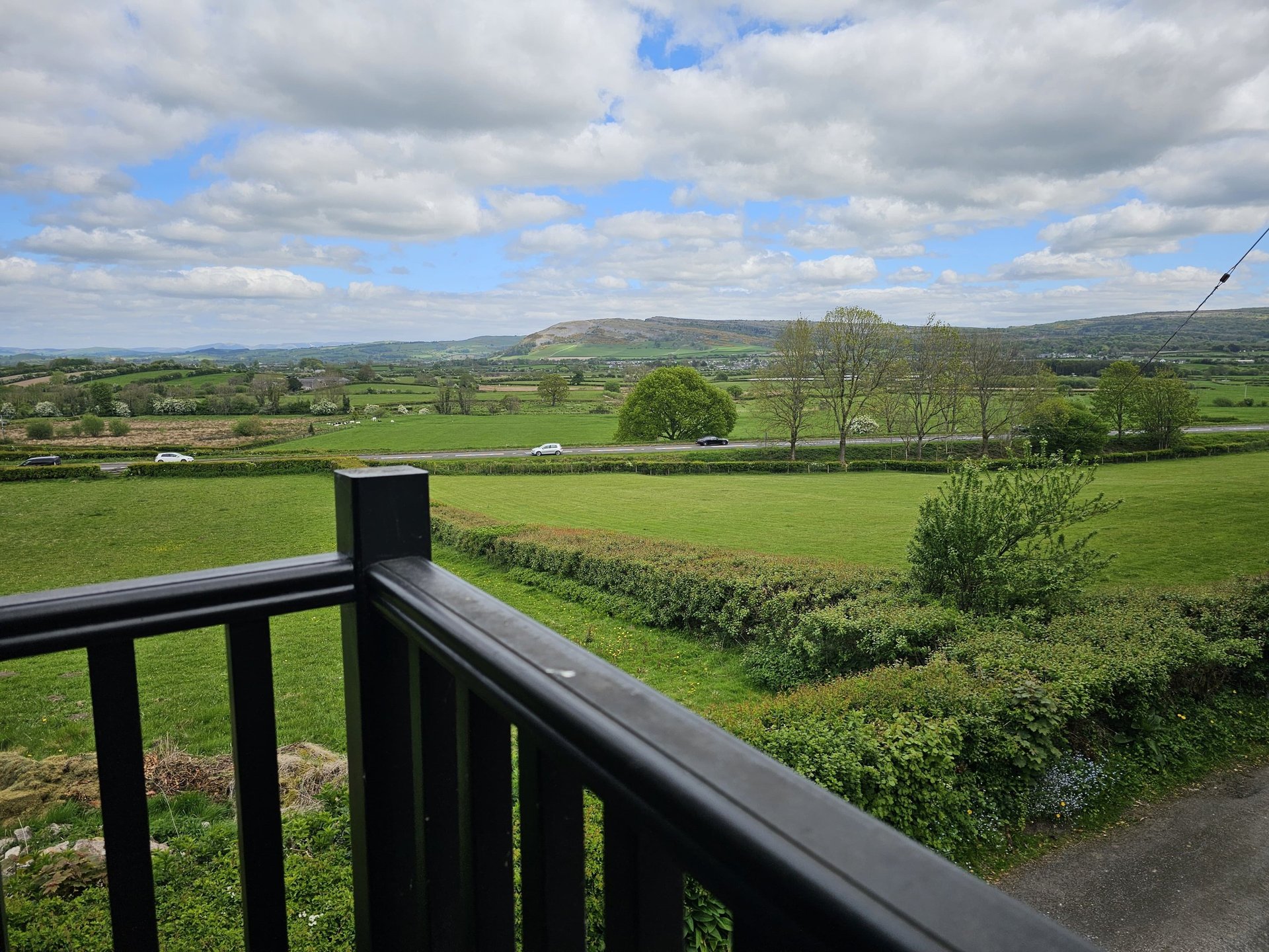 an abstract photo of a curved building with a blue sky in the background