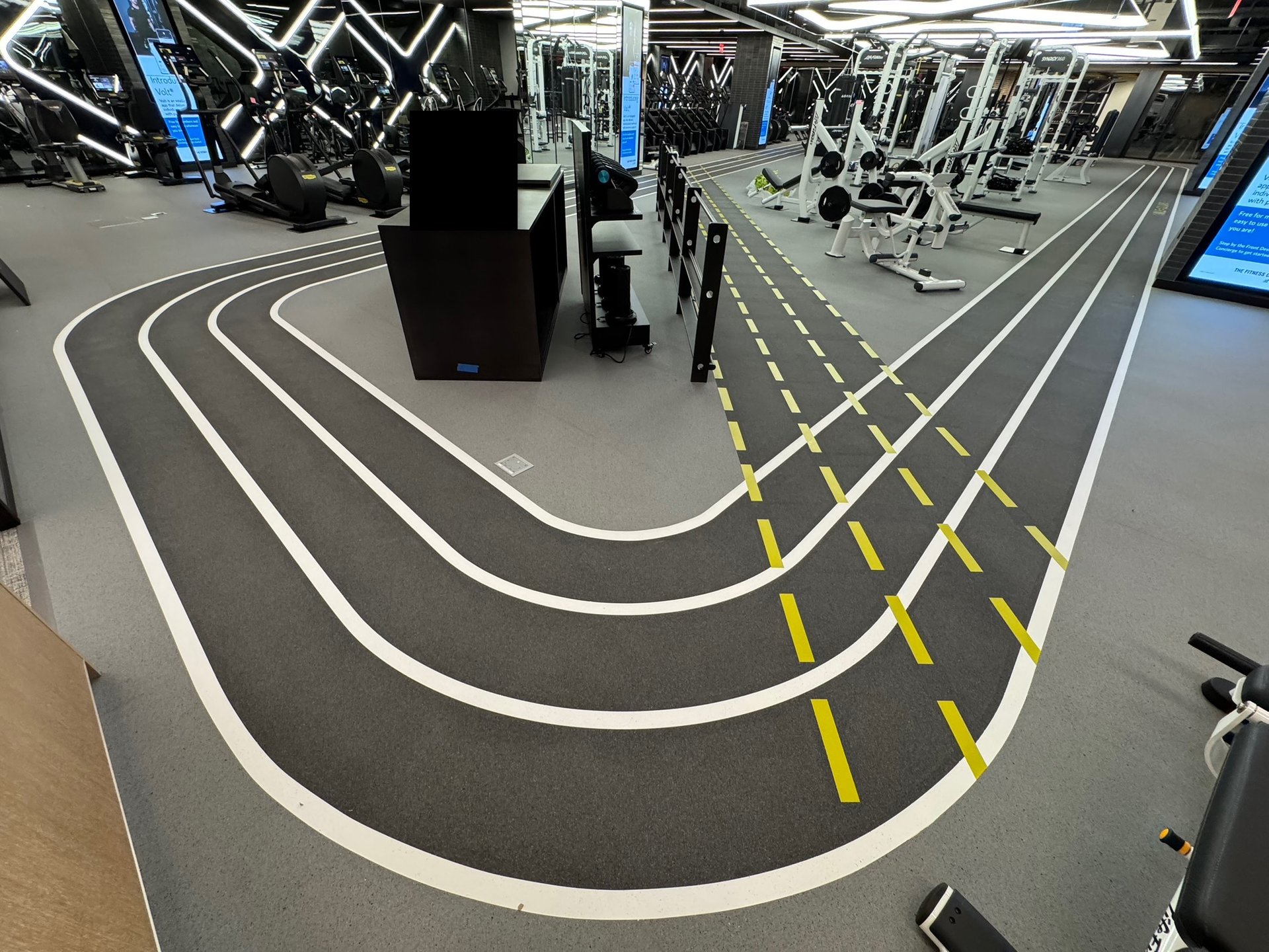 an abstract photo of a curved building with a blue sky in the background