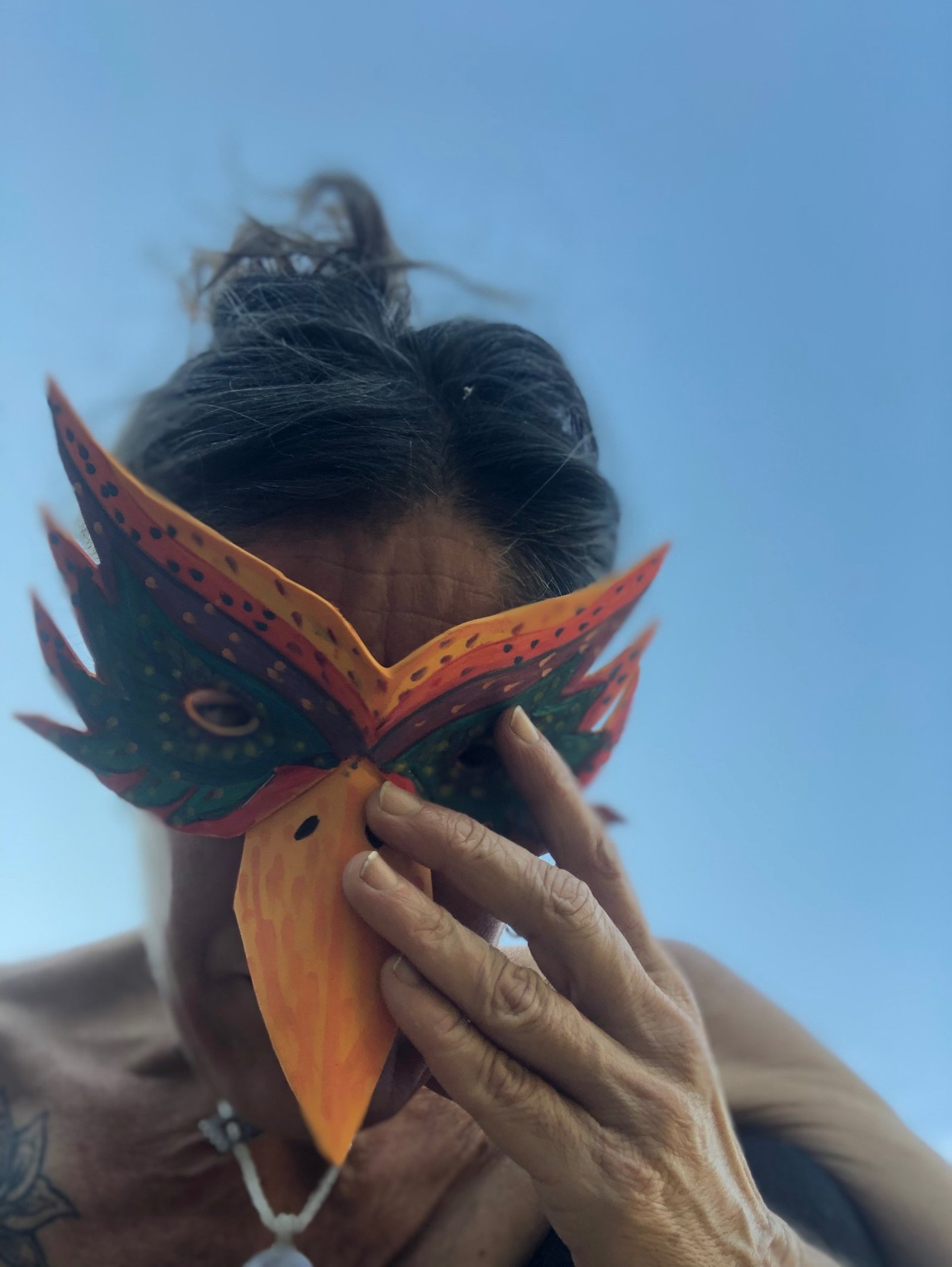 an abstract photo of a curved building with a blue sky in the background
