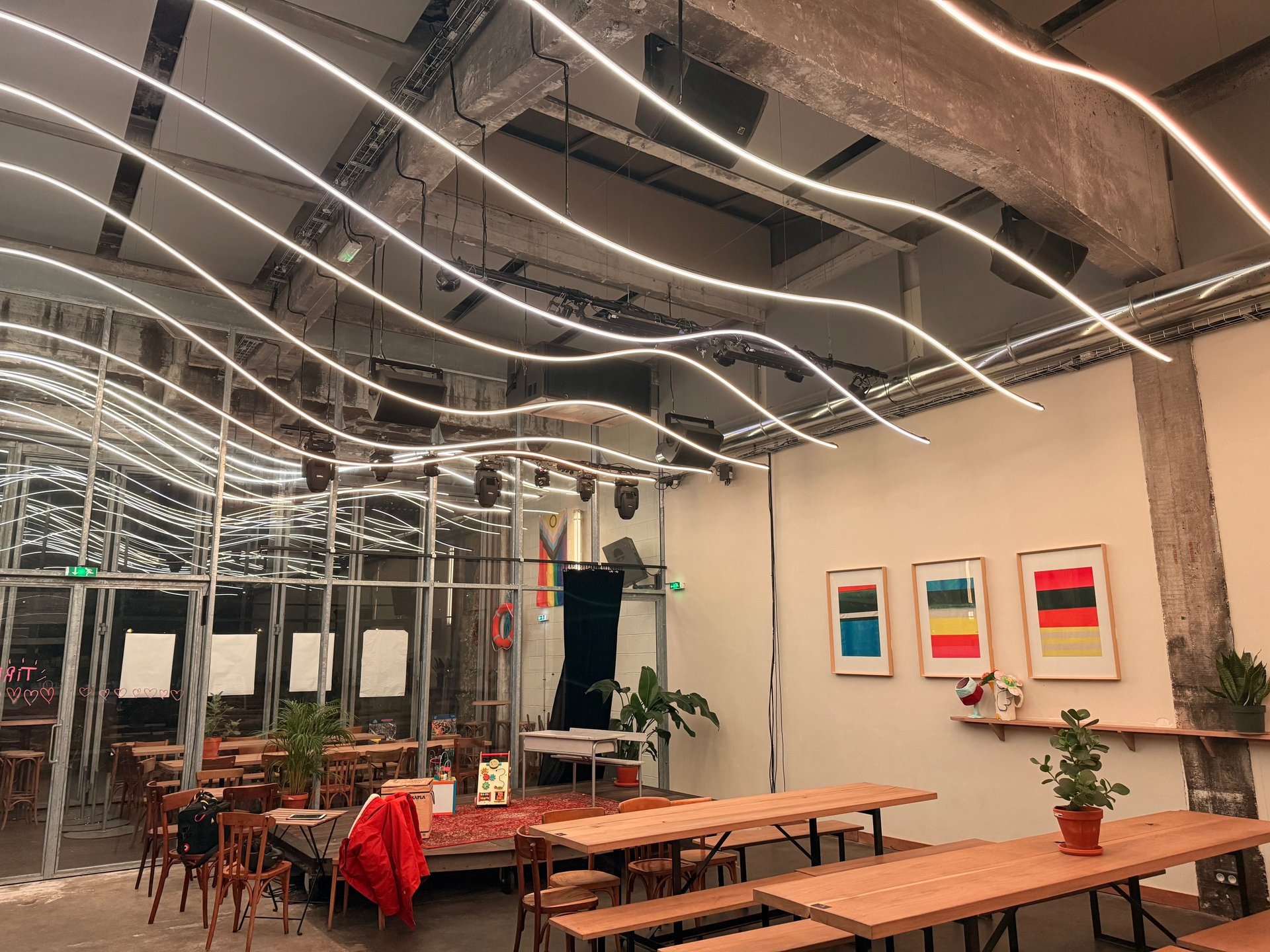 an abstract photo of a curved building with a blue sky in the background