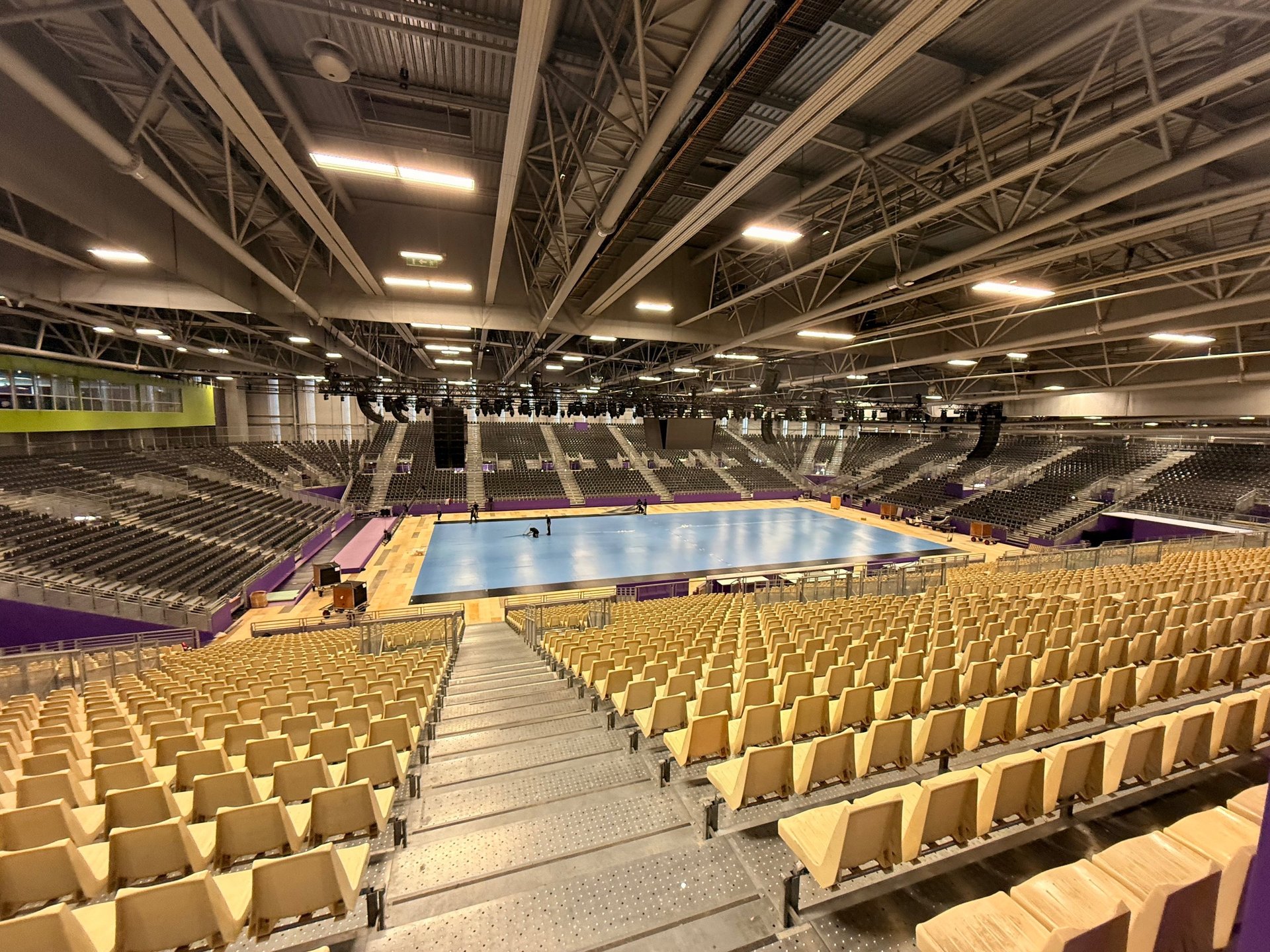 an abstract photo of a curved building with a blue sky in the background