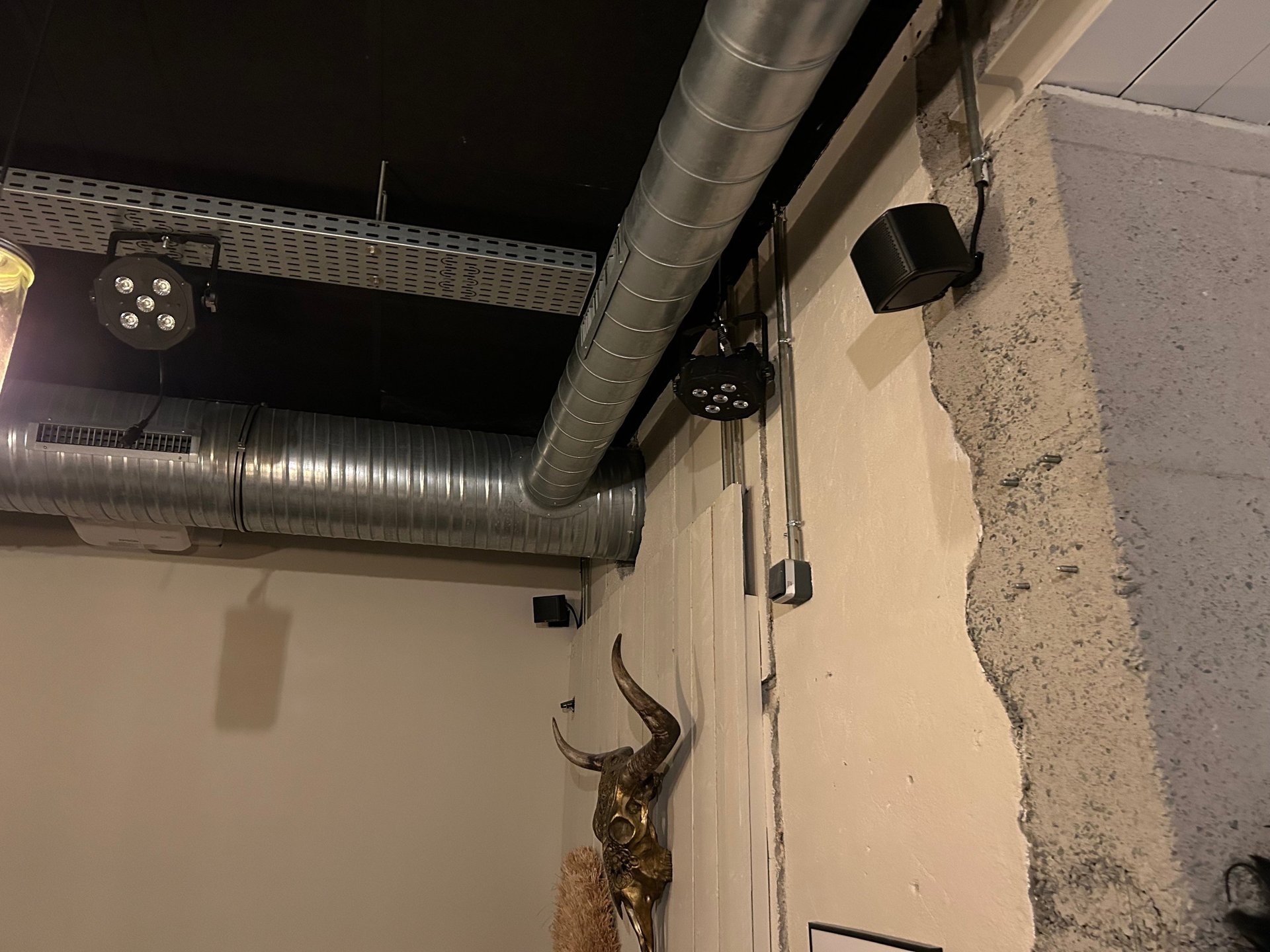 an abstract photo of a curved building with a blue sky in the background