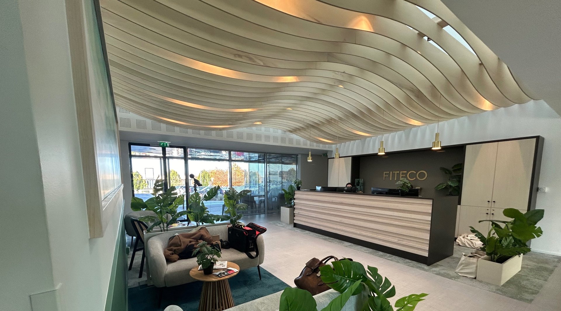 an abstract photo of a curved building with a blue sky in the background