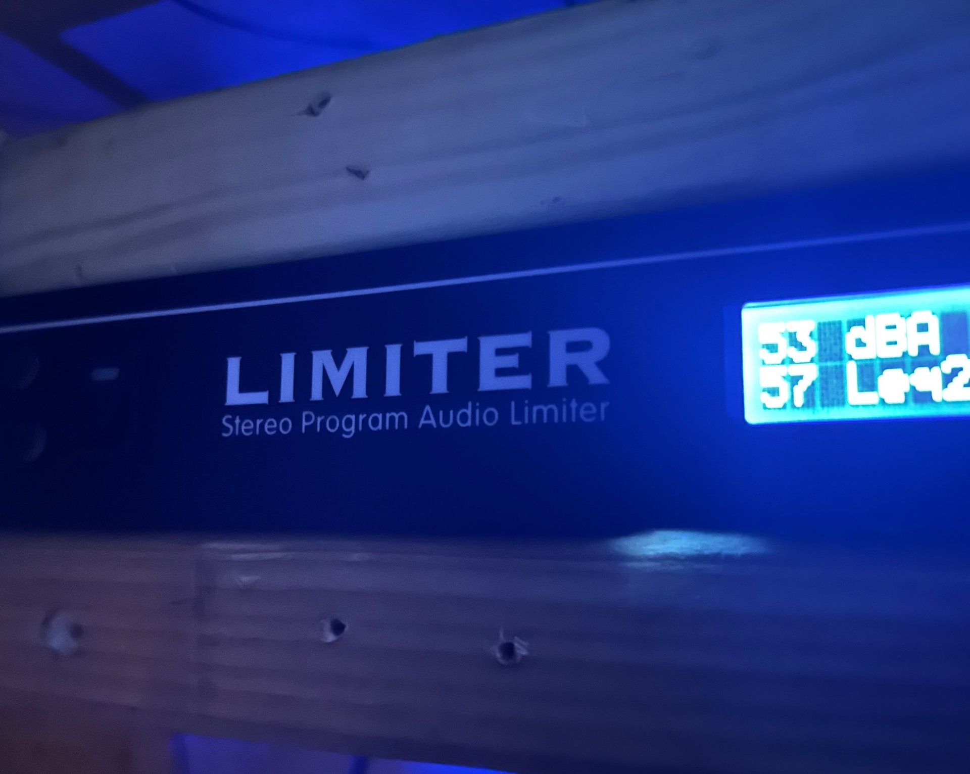 an abstract photo of a curved building with a blue sky in the background