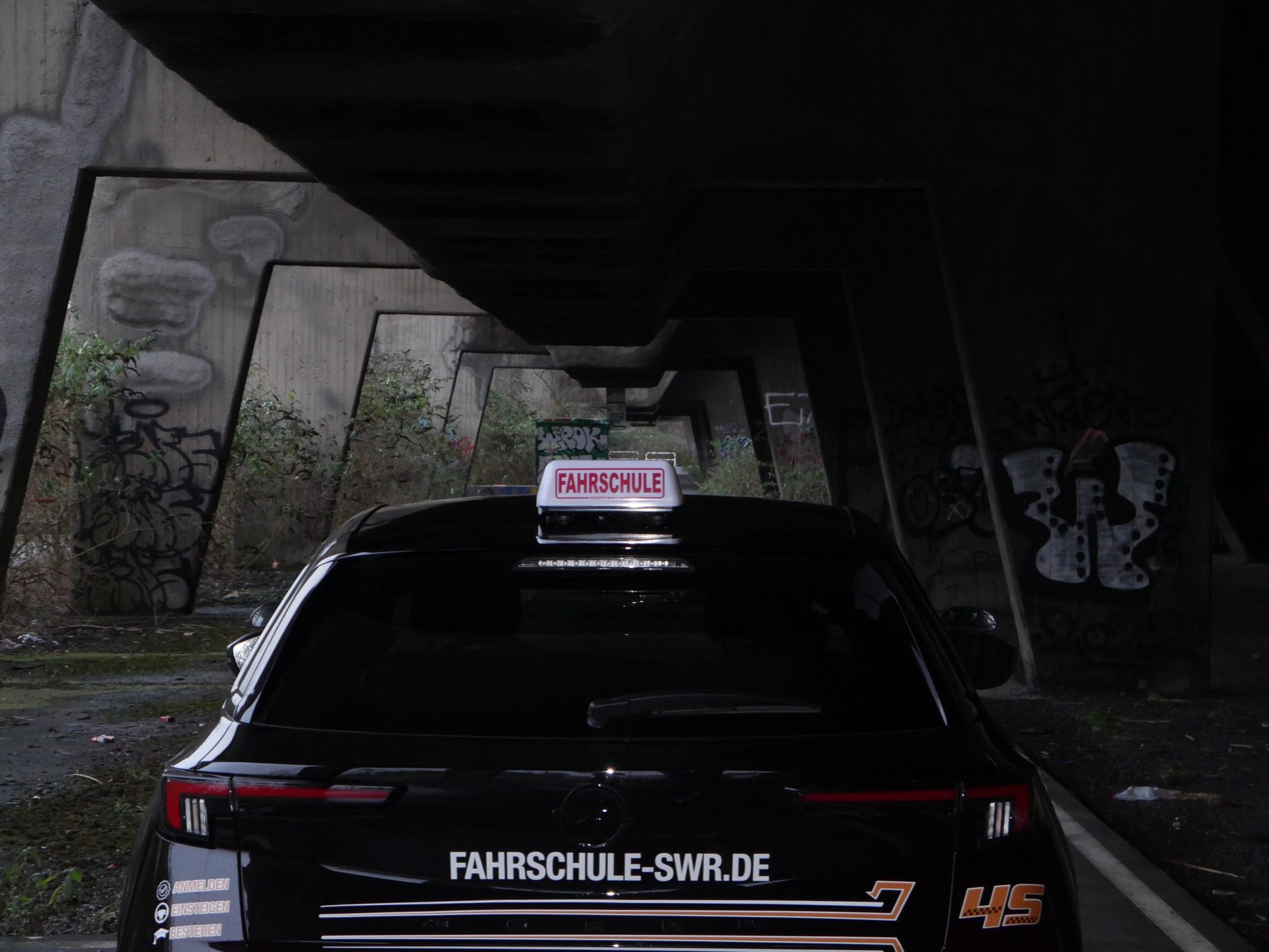 a close up of a car with a fahreschule sticker on it