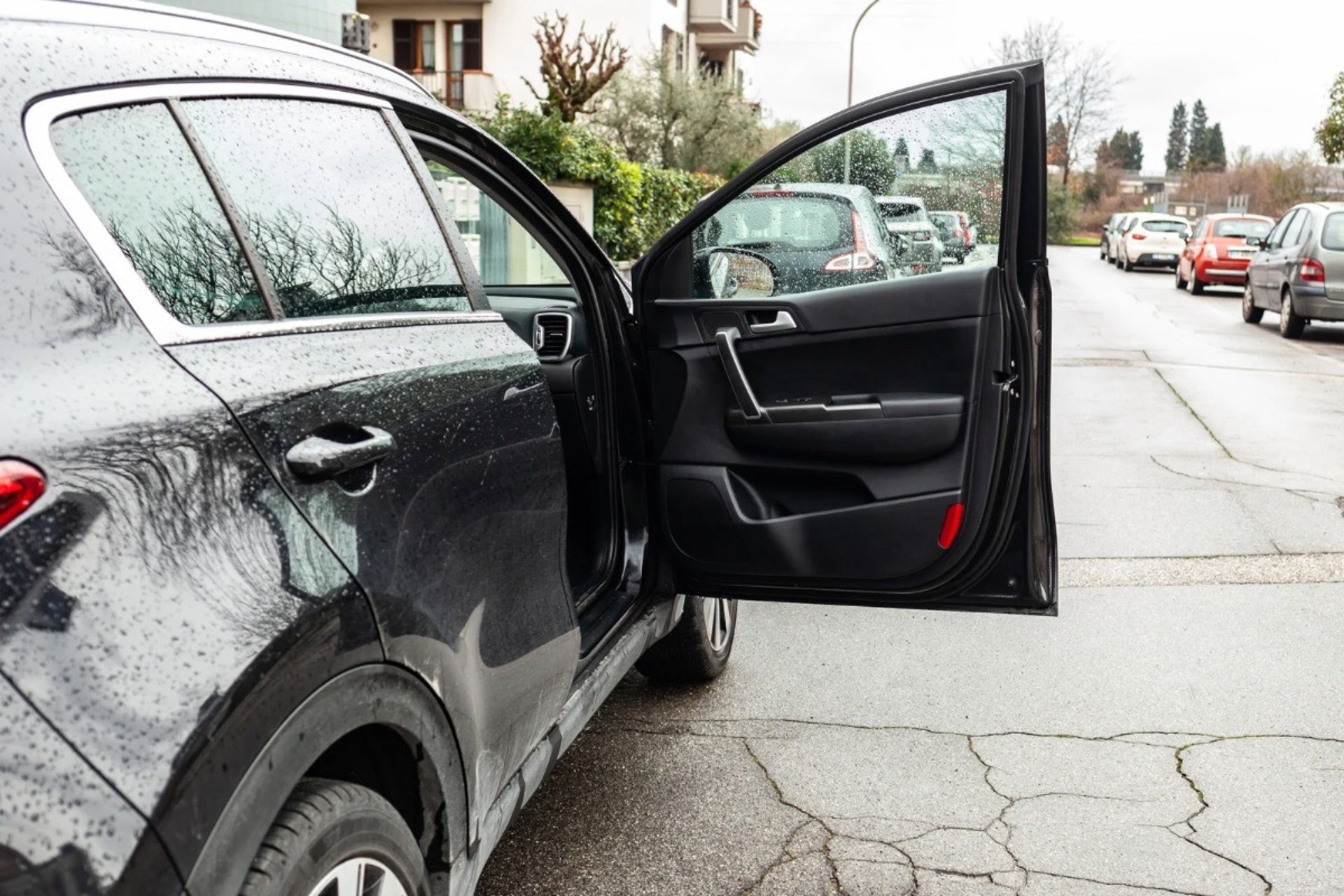 Black luxury car door unlocked representing emergency car lockout services in Spruce Pine, NC