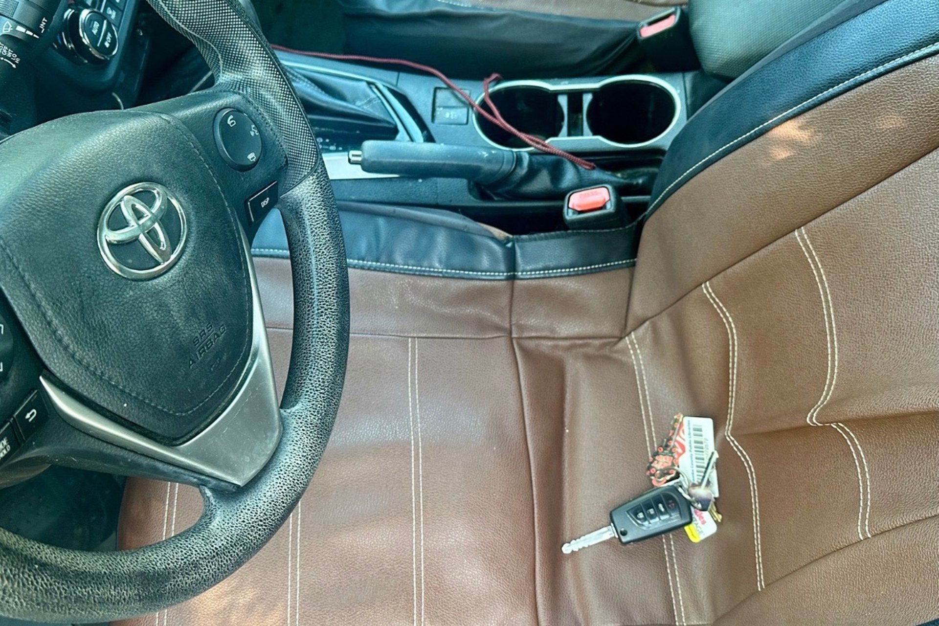 Car key locked inside of vehicle on seat—  representing emergency locksmith by Asheville Locksmith Now 