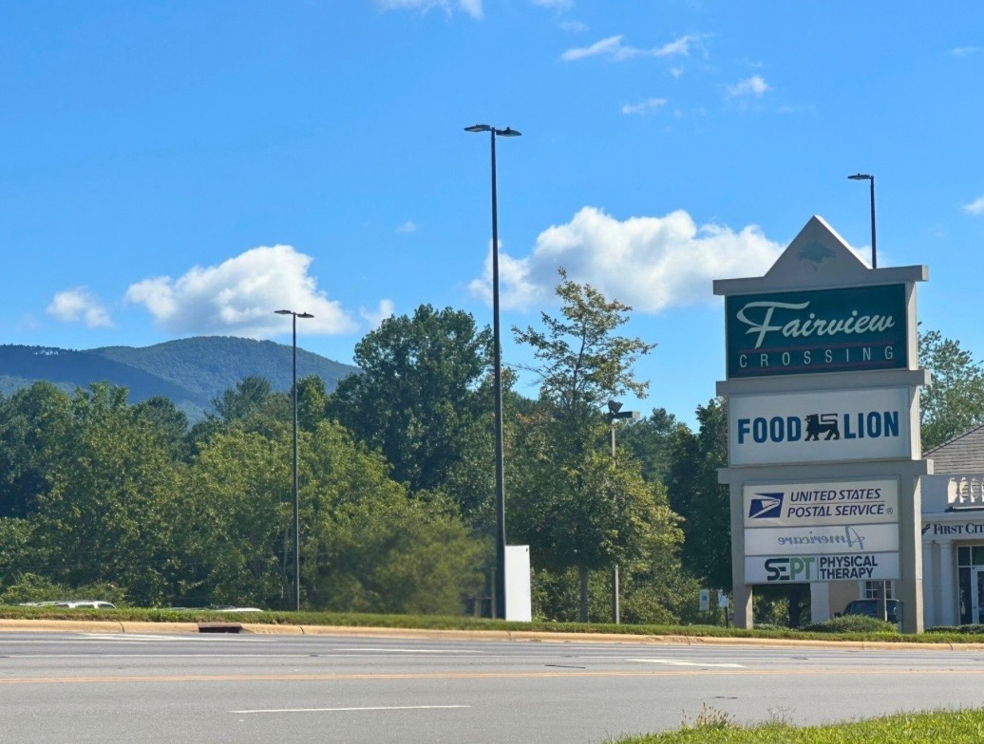 Fairview Crossings sign with Blue Ridge Parkway Mountains ahead representing Asheville Locksmith Now service area in Fairview