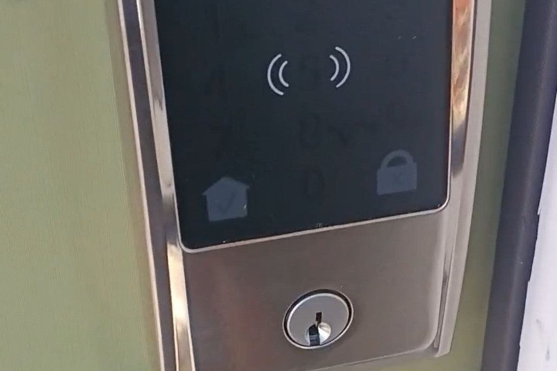 Smart keypad deadbolt lock installed on a residential door in Asheville, NC
