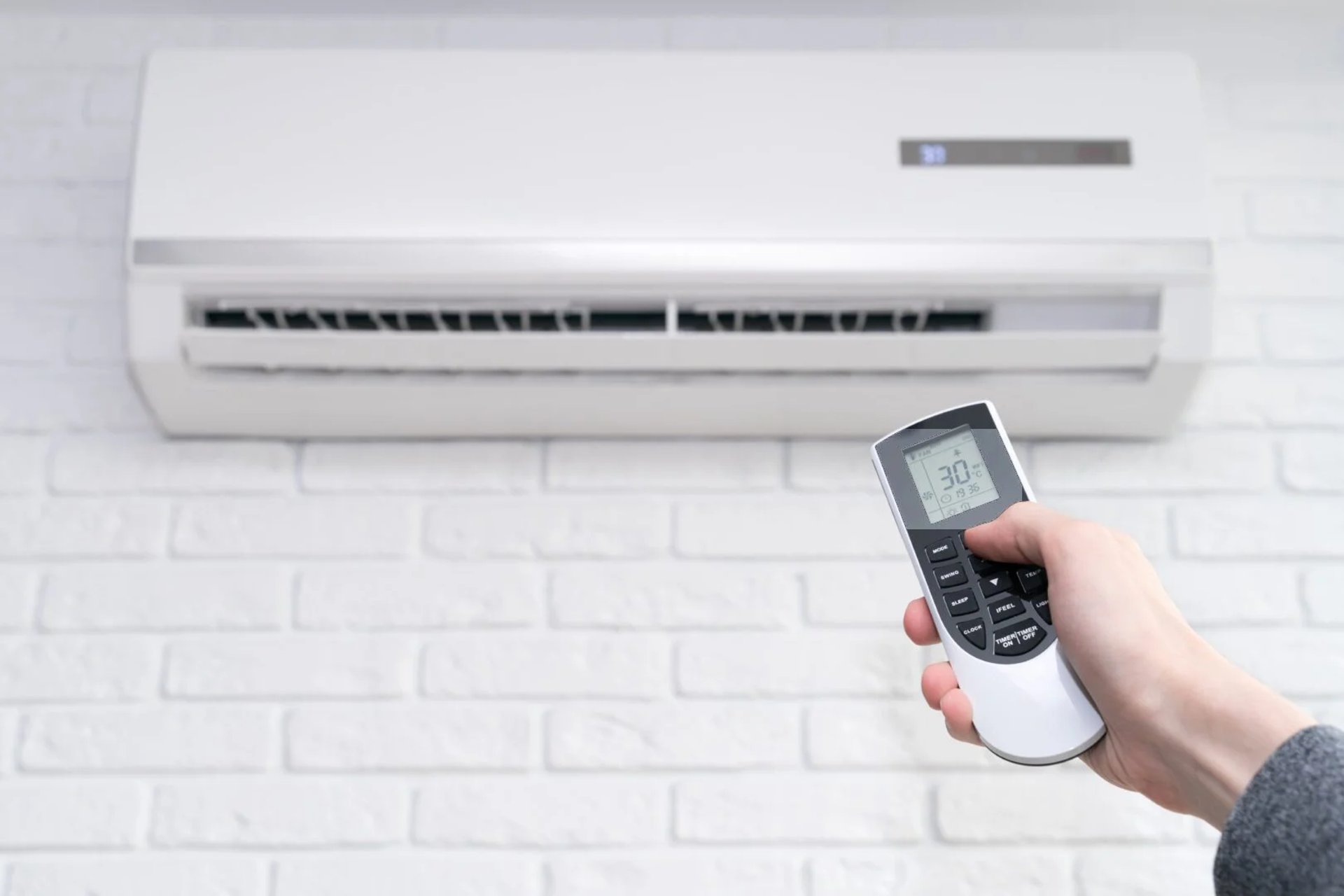 a couple of air conditioners sitting on the side of a building