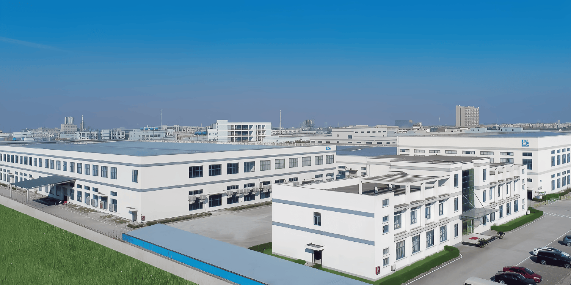 an abstract photo of a curved building with a blue sky in the background