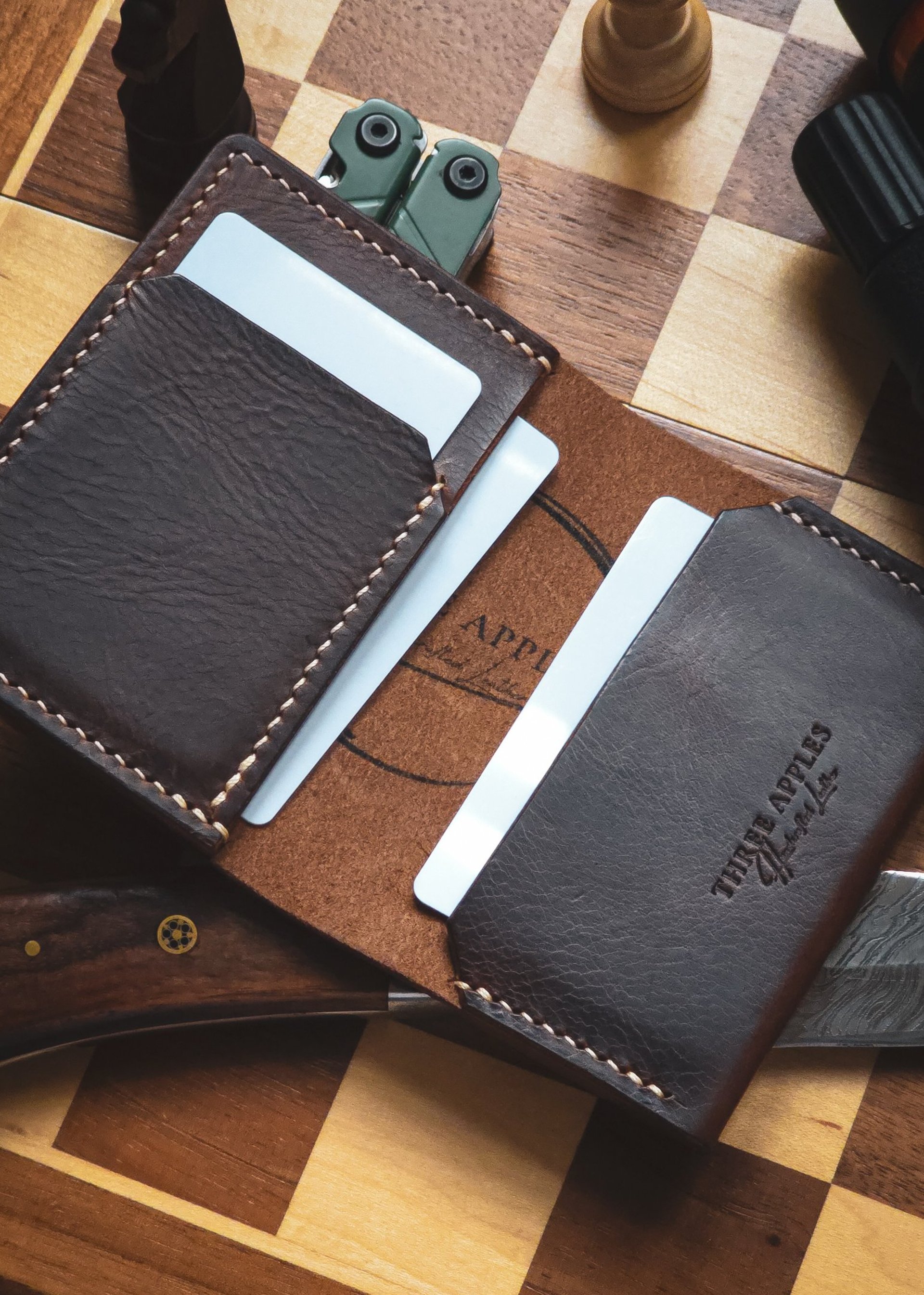 brown wooden board beside black and white pen