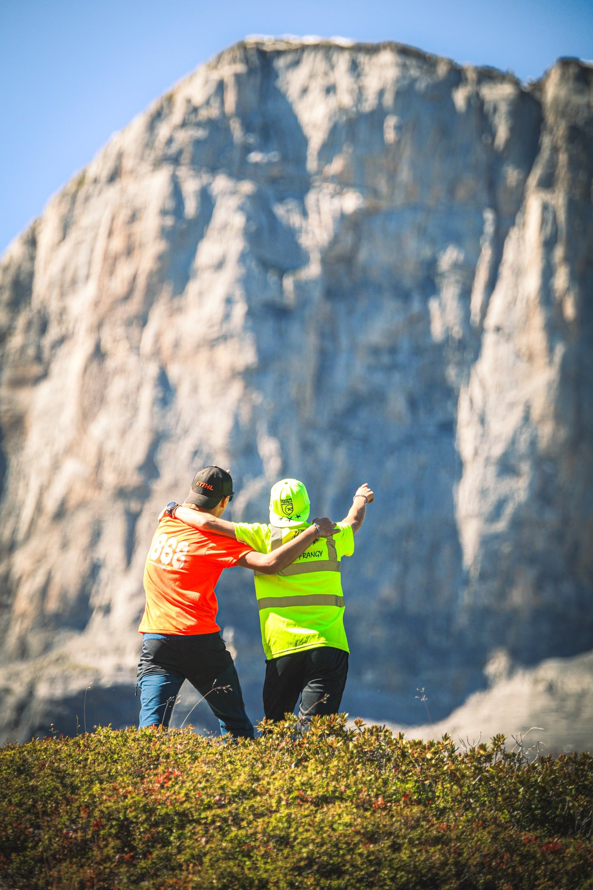 an abstract photo of a curved building with a blue sky in the background