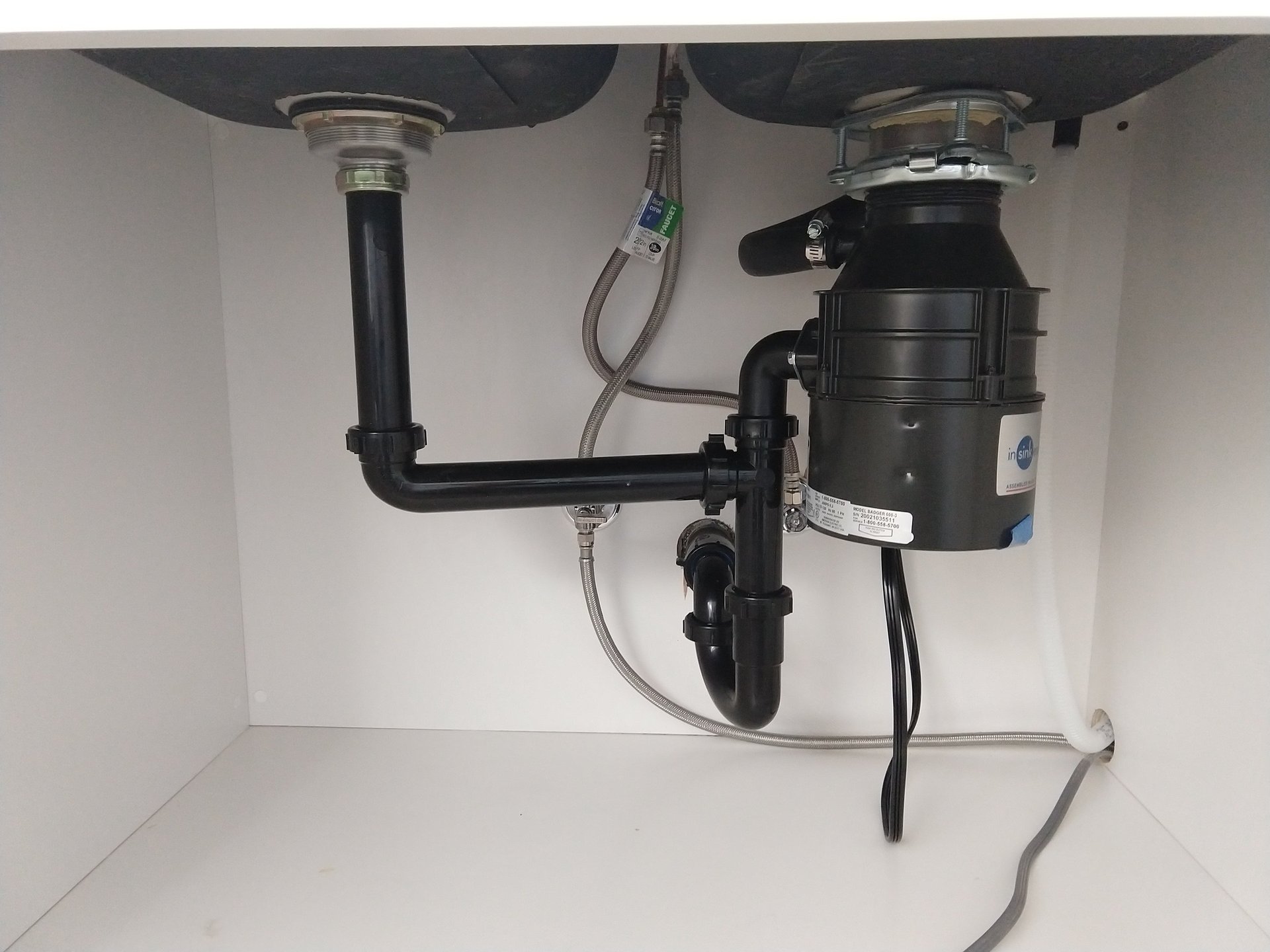 Garbage disposer under kitchen sink