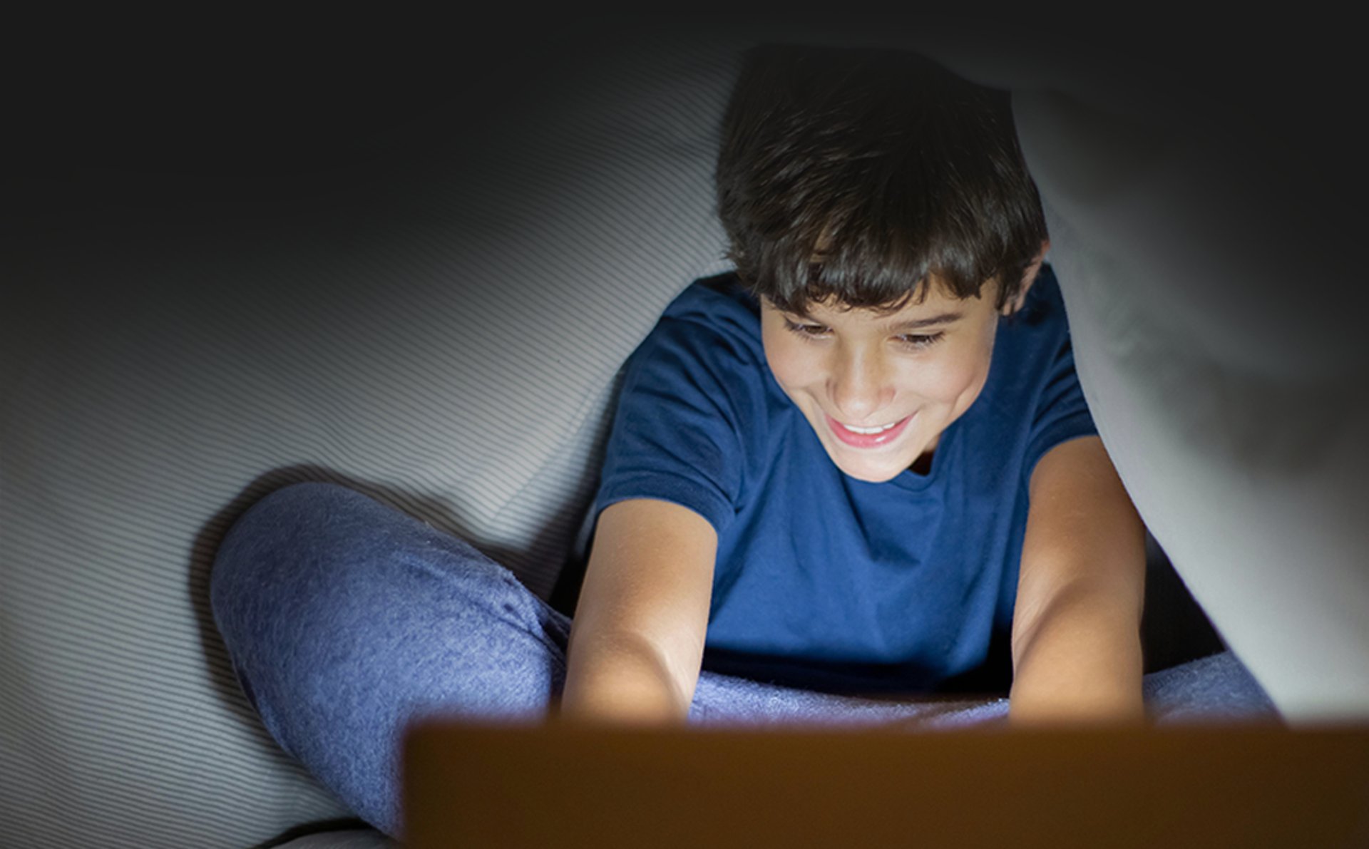 a man and two children looking at a laptop