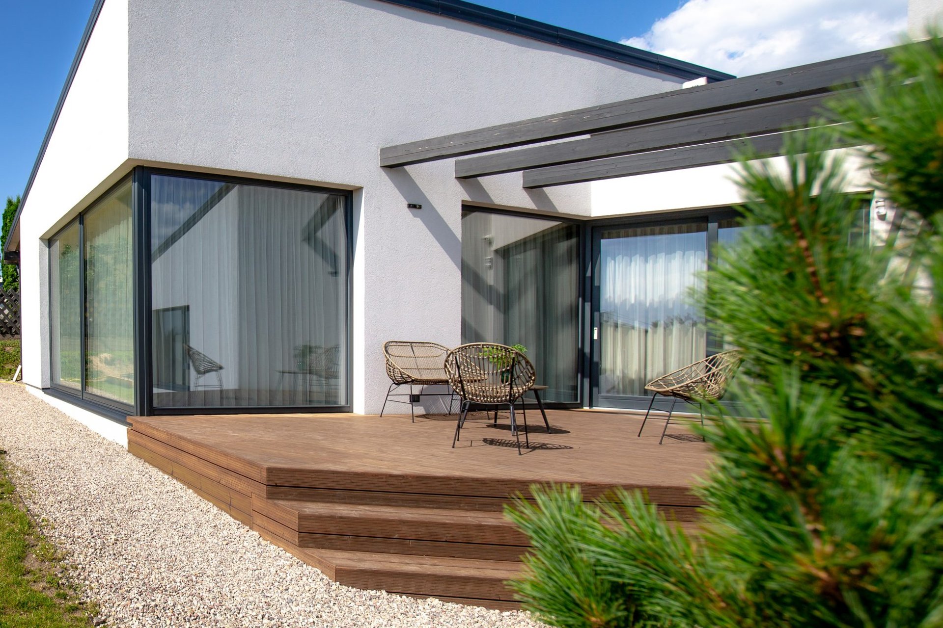 an abstract photo of a curved building with a blue sky in the background