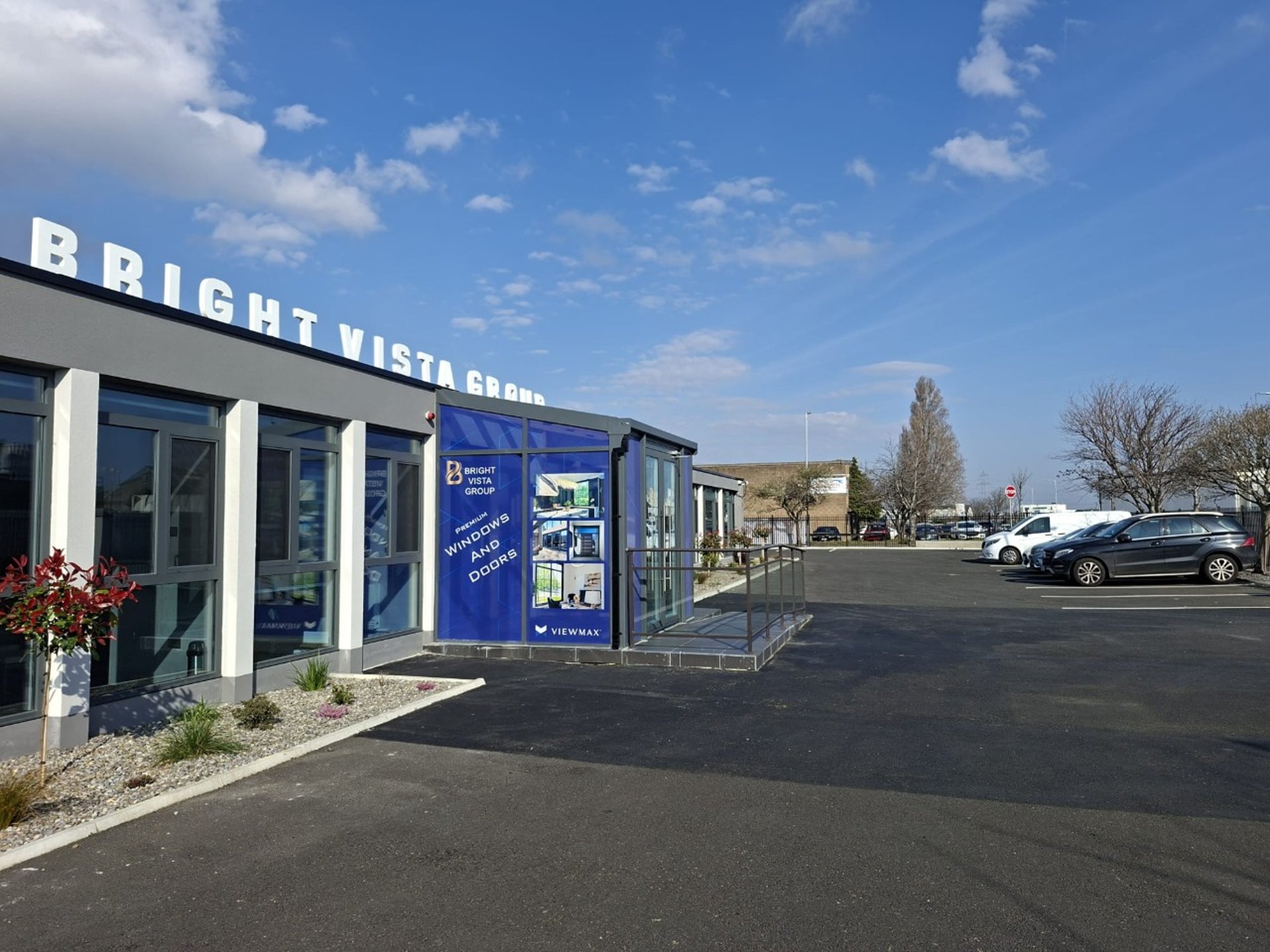 an abstract photo of a curved building with a blue sky in the background