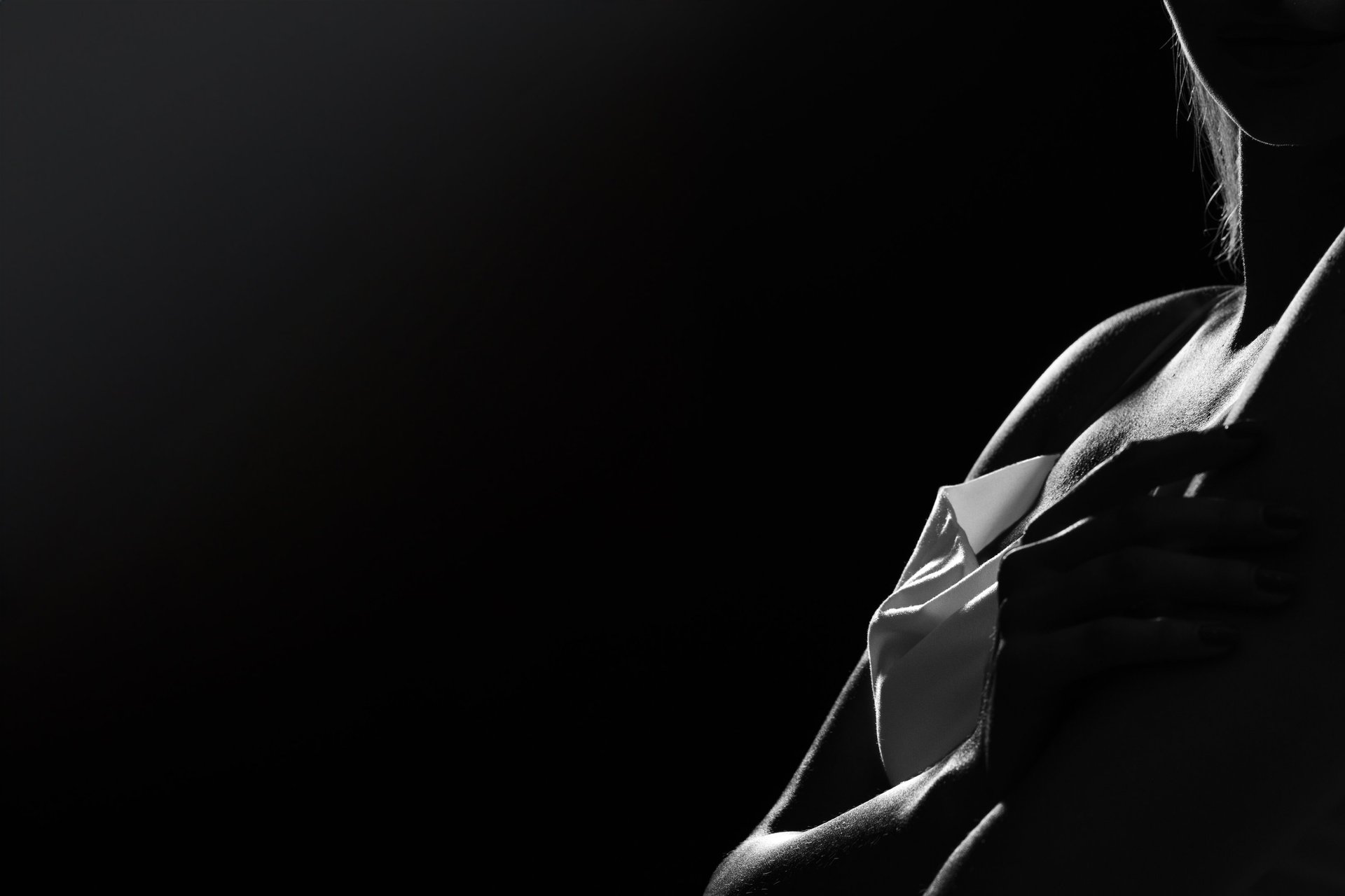 an abstract photo of a curved building with a blue sky in the background