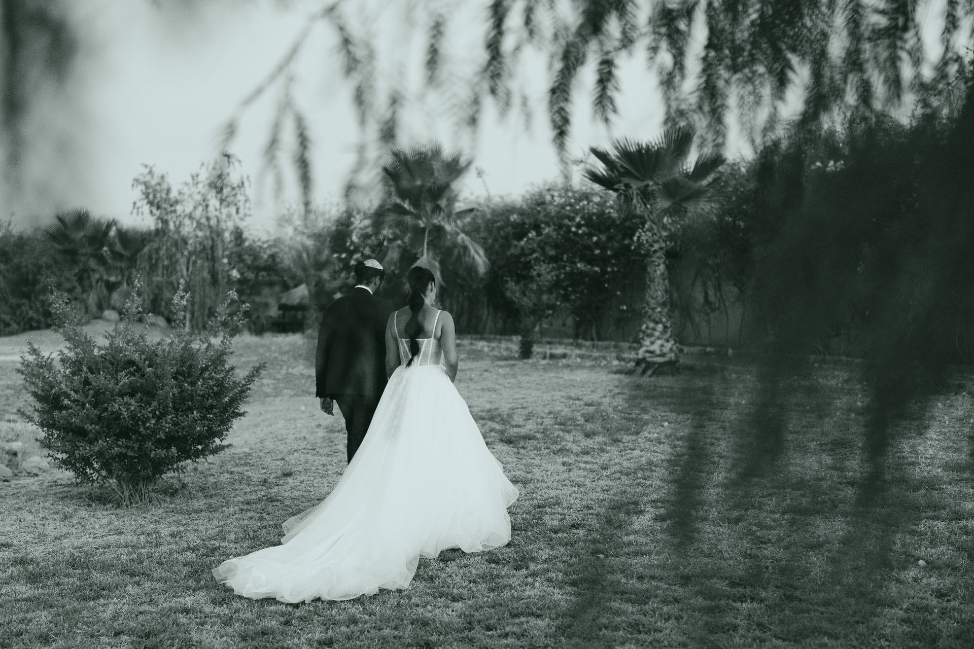grayscale shot of bride and groom