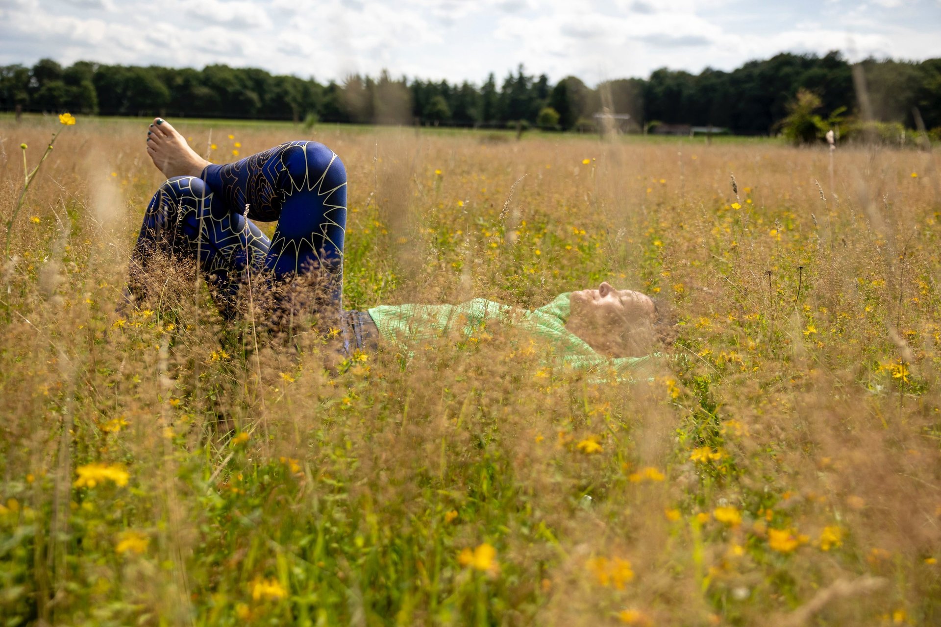 woman spreading hair at during sunset