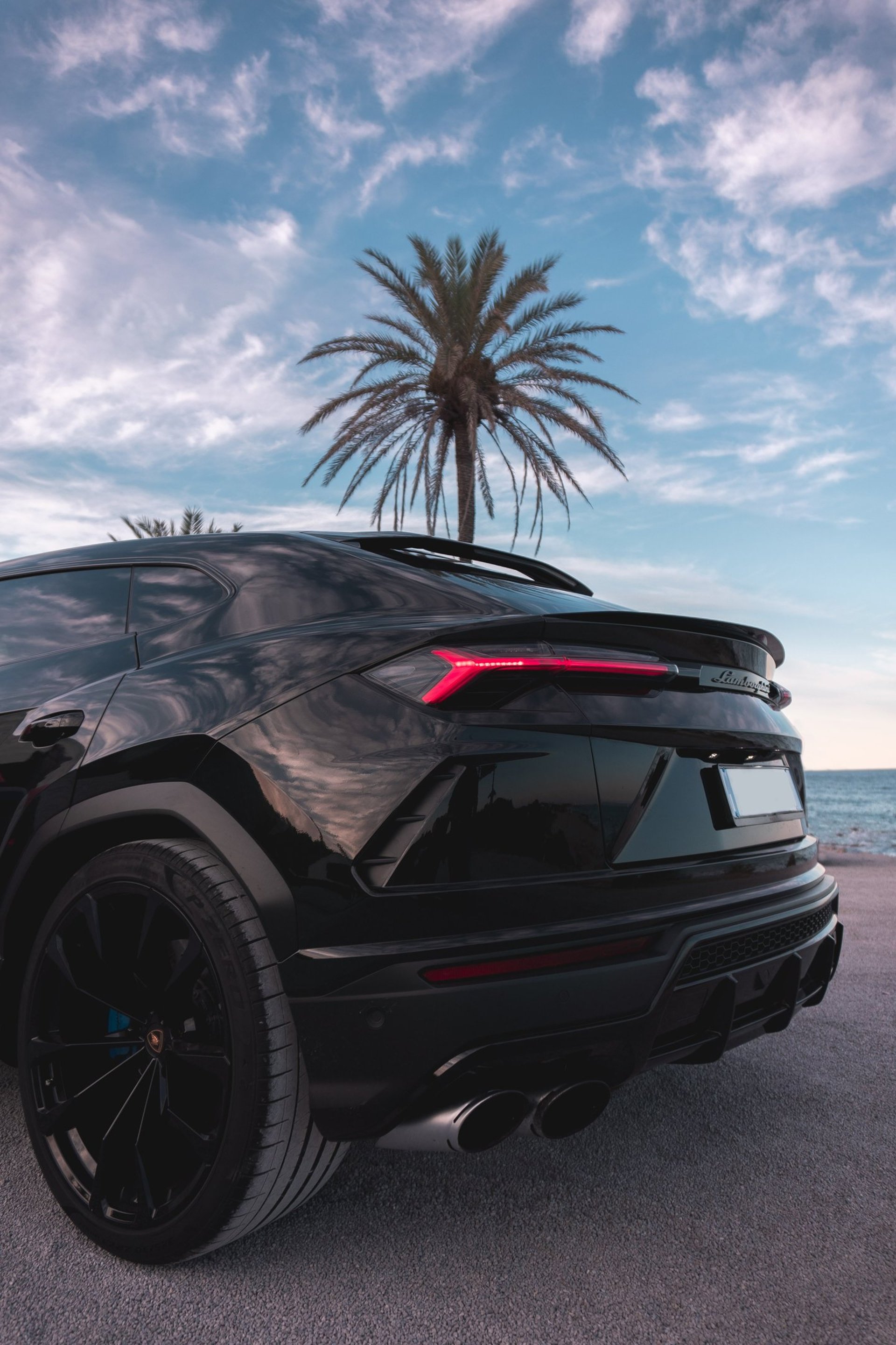 an abstract photo of a curved building with a blue sky in the background