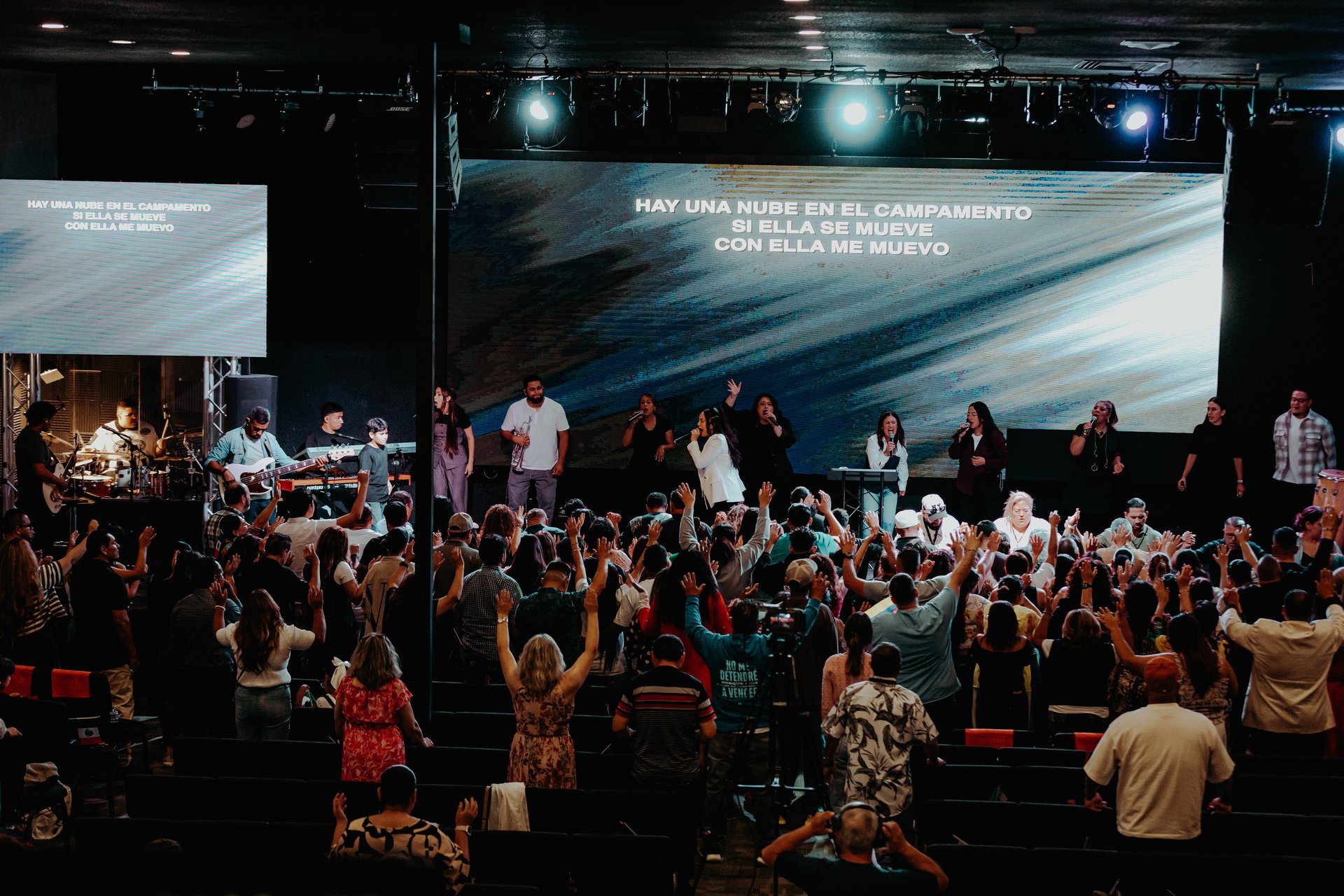 an abstract photo of a curved building with a blue sky in the background
