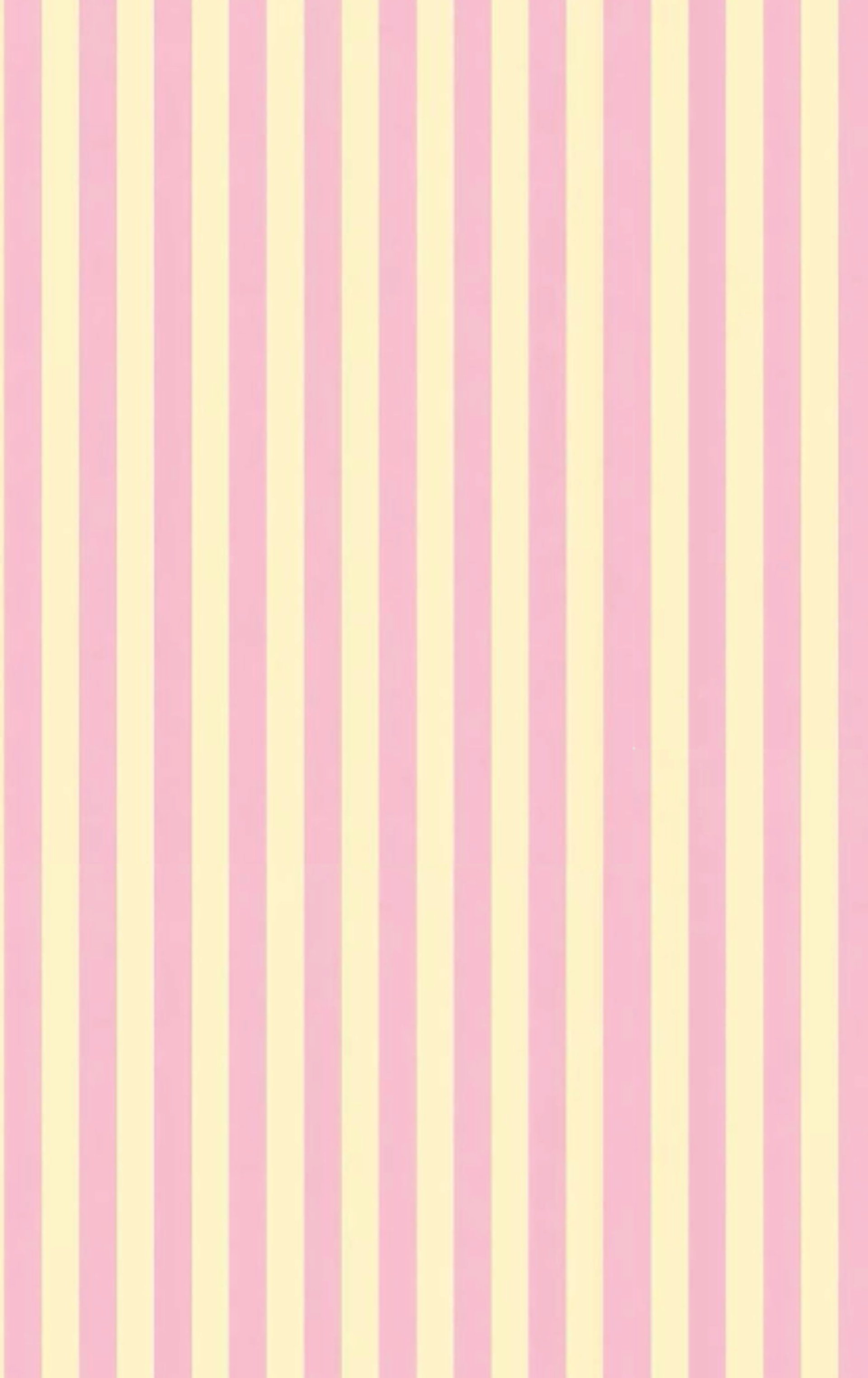 gold and silver rings on pink and white striped textile