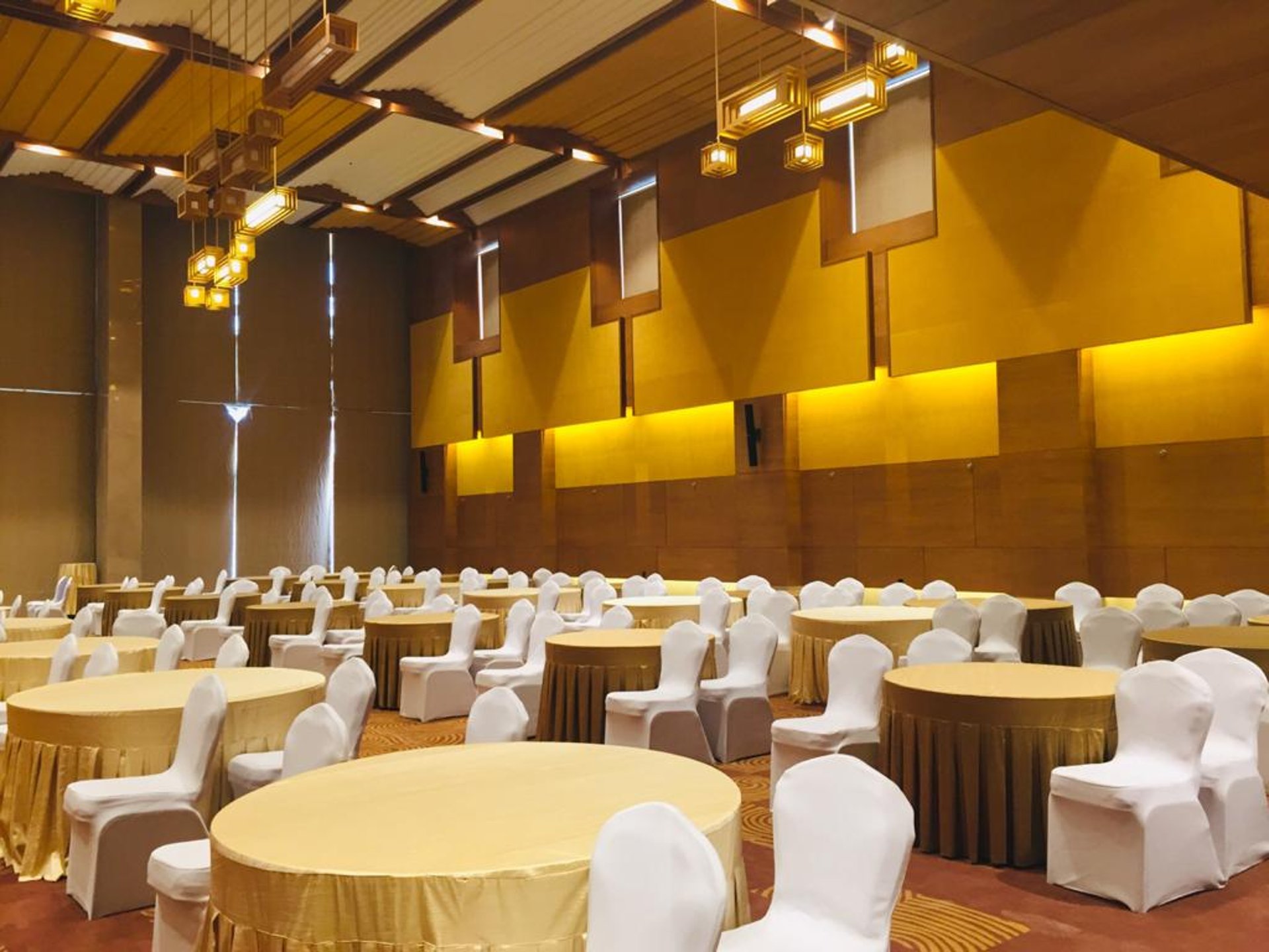 Modern hotel lobby with elevators and seating area