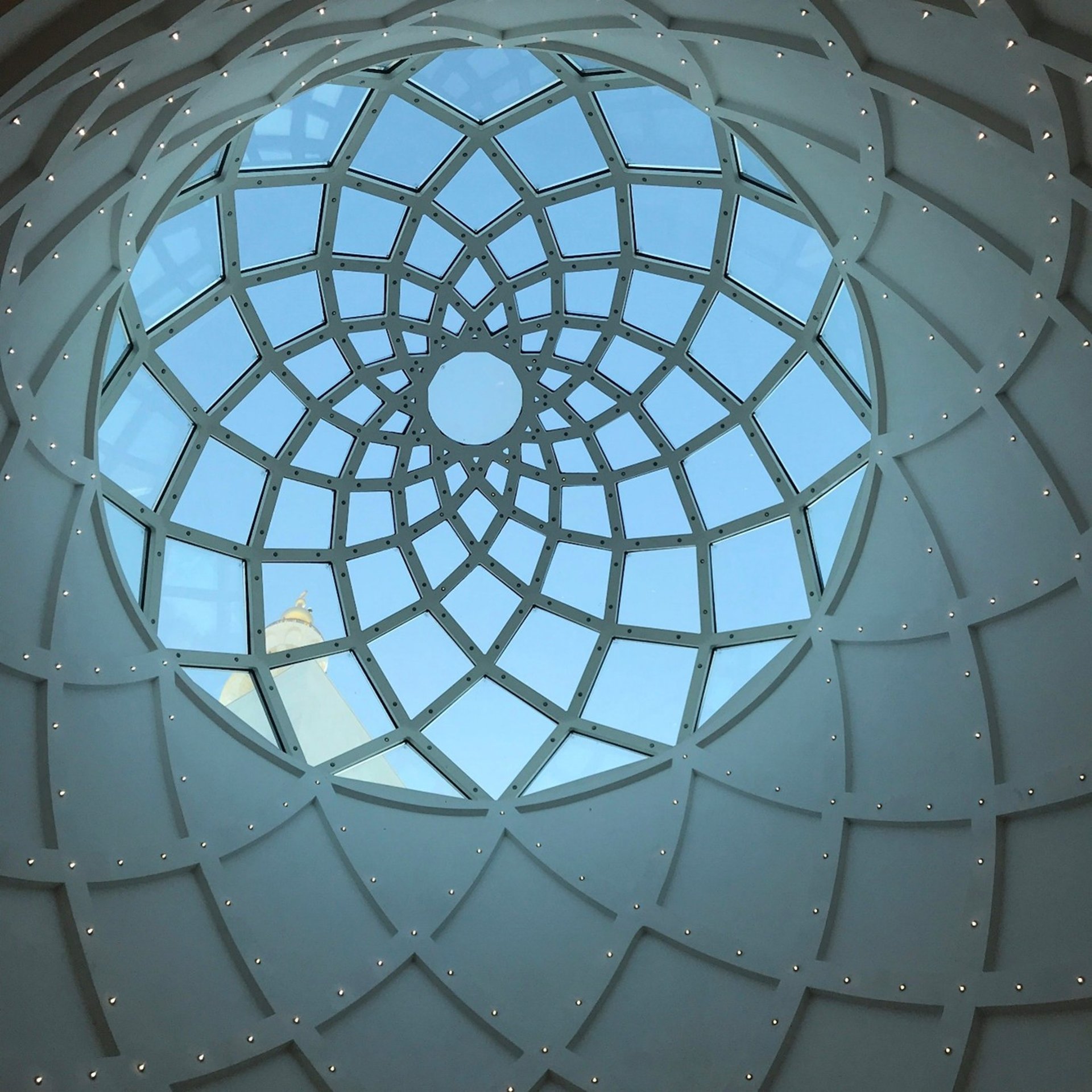 crowd of people sitting on chairs inside room