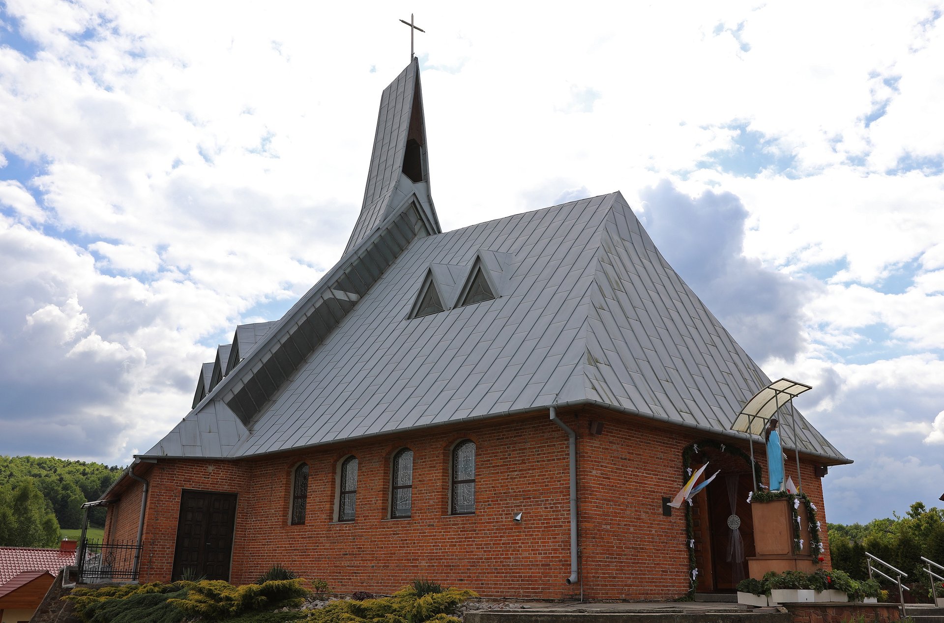an abstract photo of a curved building with a blue sky in the background