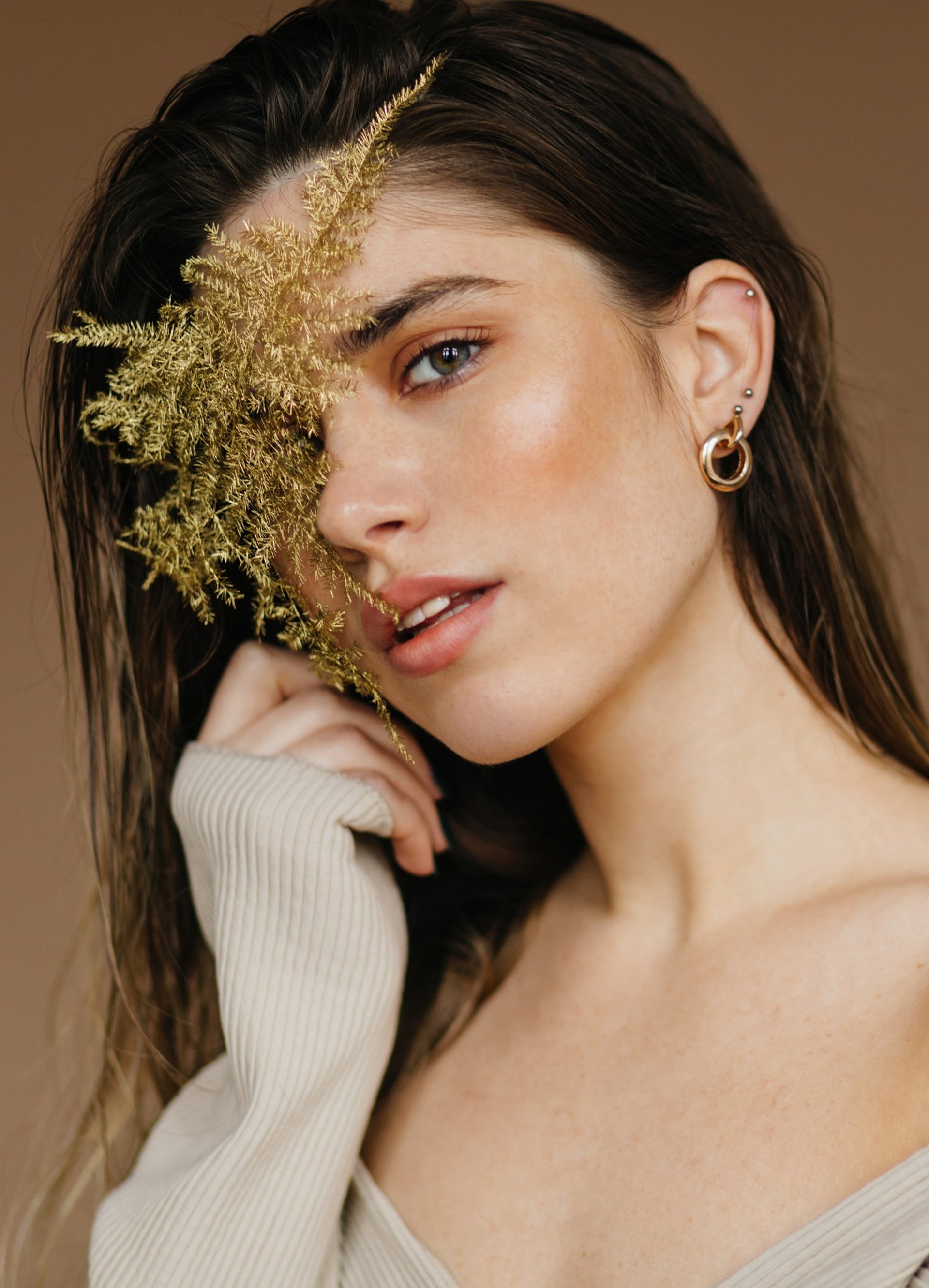 woman holding dried flower